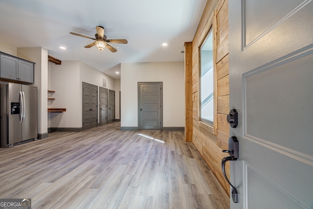 Chic & Cozy with Luxury Finishes. Your Downtown Hartwell Escape! Step into Unit 11, a perfectly designed 1-bedroom, 1-bath condo offering upscale living with a cozy feel. This thoughtfully crafted unit features high-end stainless-steel appliances, stunning granite countertops, and real wood accent walls that bring warmth and charm to every space. Bedroom boast enough cozy space. Ensuring privacy and convenience, while the open-concept layout maximizes both space and natural light. Situated next to a brand-new retail space, this unit offers direct access to Hartwell's best dining, shopping, and entertainment, all while being just a five-minute drive to Lake Hartwell Marina. Unit 11 offers the best of modern luxury in a historic downtown setting. Now available for LEASE schedule your private tour today!