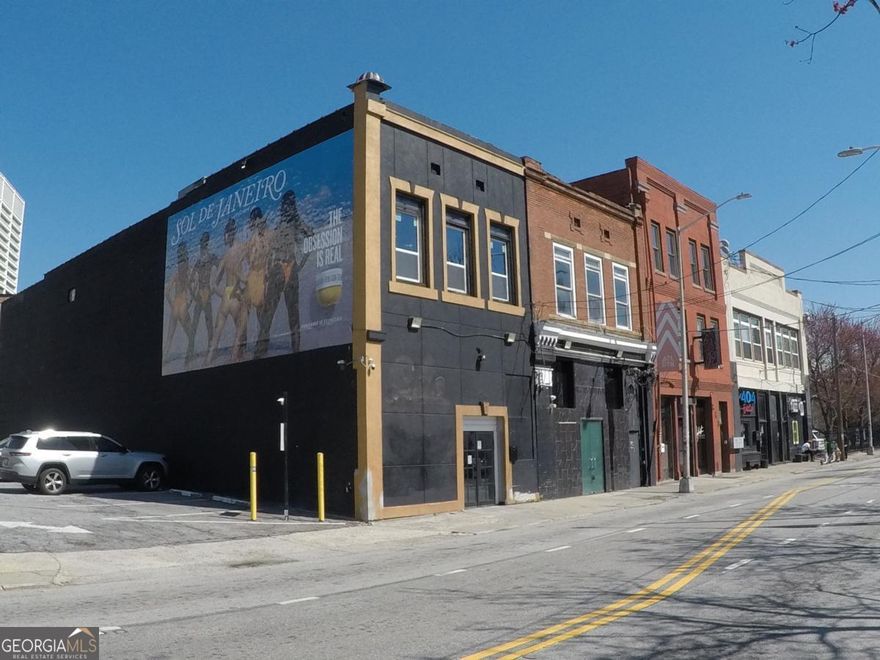 Nestled in the heart of Downtown Atlanta, this 35,000 SF mixed-use property spans three contiguous parcels (approximately 0.30 acres) and represents a truly unique investment opportunity. Offered at $8,000,000 with a projected Net Operating Income of $430,000, the asset provides strong in-place cash flow from a diversified rent roll, alongside significant long-term upside. The current tenant mix includes recently renovated apartments and street-level retail (a tattoo shop and salon), plus several restaurant/lounge/nightclubs with new tenant buildouts underway - creating multiple income streams under one roof. Extensive renovations (including a brand-new roof and modernized apartments) have already been completed, enhancing the property's appeal and minimizing future capital expenditures for a new owner. trategically positioned amid Downtown's ongoing resurgence, 251 Trinity Ave SW offers unparalleled redevelopment flexibility thanks to its SPI-1 zoning. The site is surrounded by transformative development activity - just steps from Atlanta Tech Village's new downtown campus and Wild Leap Brewery - and benefits from proximity to major projects fueling growth in the area. This mixed-use asset perfectly balances immediate income production with future redevelopment potential, making it an ideal acquisition for investors and developers seeking both stable cash flow and long-term value appreciation in a prime urban location.