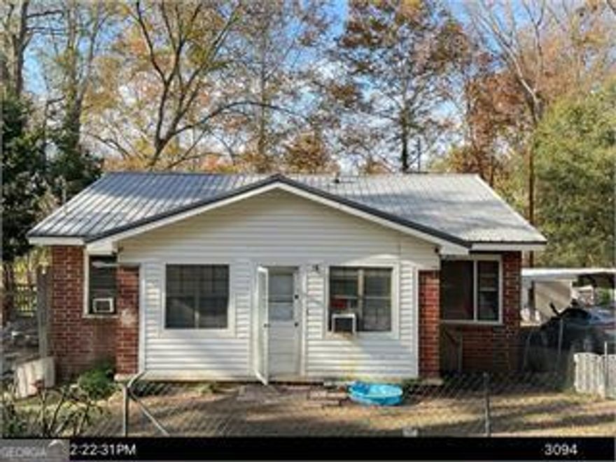 This 2-bedroom, 1-bath brick home is brimming with character and ready for your personal touch. Situated on a quiet street, this solid structure features a durable metal roof, classic brick exterior, and a cozy layout perfect for first-time buyers, investors, or DIY enthusiasts.    Inside, you'll find a functional floor plan with original features waiting to be restored or reimagined.     With a bit of TLC, this hidden gem could shine-whether you're looking to renovate and resell or create your dream cottage-style home.    Sold as-is. Come see the potential and make it yours today!