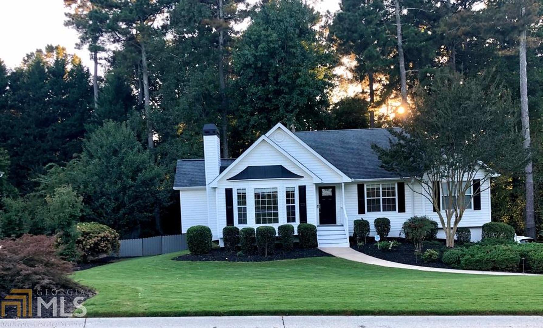 Welcome Home! This is a beautiful completely renovate 4/3 ranch home. It has a gorgeous fireplace in the living room with gas logs. The back of the house has a nine window sunroom overlooking the wooded backyard. Also to extend the enjoyment of the backyard past sunset it is completely moonlit. The architectural lighting on the front and the moonlighting in the back add safety and security to the property. The kitchen is completely redone with stainless steel appliances, tile backsplash and hardwood floors. The master bath has a large walk-in closet and a beautiful tile walk in shower. The master and main bedrooms have tile floors. Come take a look!