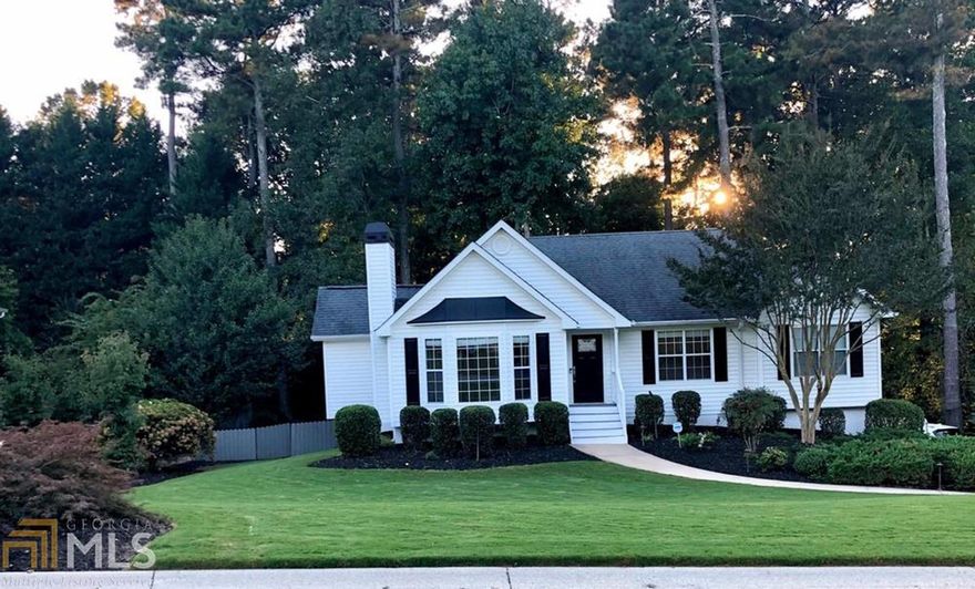 Welcome Home! This is a beautiful completely renovate 4/3 ranch home. It has a gorgeous fireplace in the living room with gas logs. The back of the house has a nine window sunroom overlooking the wooded backyard. Also to extend the enjoyment of the backyard past sunset it is completely moonlit. The architectural lighting on the front and the moonlighting in the back add safety and security to the property. The kitchen is completely redone with stainless steel appliances, tile backsplash and hardwood floors. The master bath has a large walk-in closet and a beautiful tile walk in shower. The master and main bedrooms have tile floors. Come take a look!