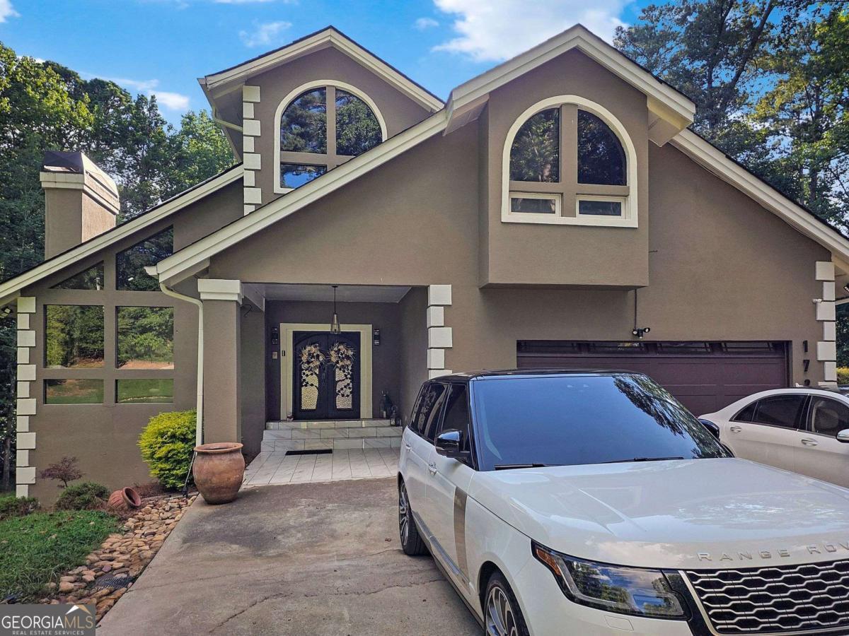 Welcome to your private retreat in Cascade Nature Preserve. This gated estate sits on just under 2 acres and offers over 5,400 square feet of living space across three levels perfect for entertaining and everyday comfort. Step inside to 5 spacious bedrooms and 4 and a half bathrooms, including a private primary suite secluded on the second floor. Multiple living and dining areas provide ample space for gatherings. The finished basement is a entertainer's dream complete with a gym, game room, full bar, and guest suite. Outside, enjoy summer days by the sparkling pool, or host unforgettable evenings across multiple outdoor living spaces. Surrounded by million plus estates, this home offers both prestige and privacy in one of the area's most desirable enclaves in a premier location.