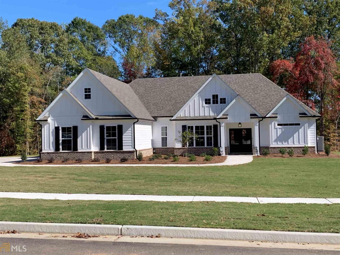 Custom Home Built by Dague Communities - Stunning Home Offering 3 Car Garage - Covered Porch Entry Way, Inviting Foyer, Formal Dining Rm, Open Floor Plan, Spacious Family Room with Fireplace, Opens to Kitchen Offering*Breakfast Area*Stainless-Steel Appliances*Granite Counters*Tile Back-splash*Custom Cabinetry w/Under-Counter Lighting*Pantry, Mud Room, Hardwood Flooring in Foyer*Dining*Family*Kitchen*Breakfast Area**Master Suite on Main w/Trey Ceiling, Master Bathroom w/Tile Flooring* Separate Tile Shower*Tile Surround Garden Tub* Huge Walk-In Closet w/Wood Shelving, Over-sized Bedrooms on Main w/Private Bathrooms for Each, Upstairs is the 4th Bedroom which Offers Private Bathroom, Storage Galore, and an additional Office!