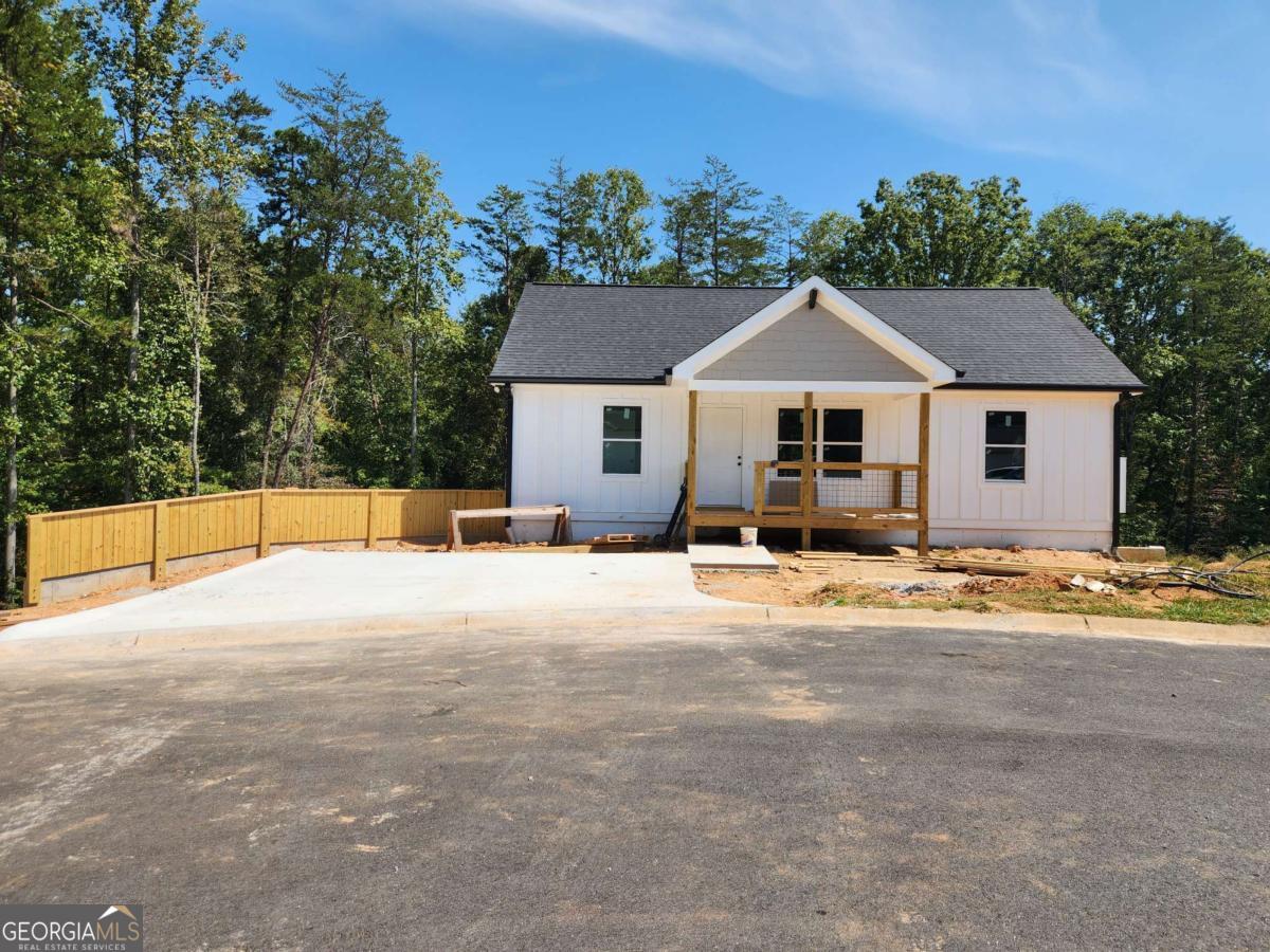 Hard to find, NEW CONSTRUCTION home rental in 55+ community in excellent, highly sought after residential area of Lumpkin County. This rental is on the main level, and includes 2 master suites with walk-in closets, covered front entry. Low maintenance, luxury vinyl floors, pantry cabinet, stainless appliances. Covered rear balcony. Rent includes water, trash, lawn maintenance, pest control, filter changes, & mailboxes. Convenient to town, new grocery store, hospital, 400. Community of 18 units, level front yard & street, curb & gutters. Deposit and credit check required. Pets allowed with deposit. Hurry these never last. Currently under construction, to be ready for move-in on November 1, 2025. Separate downstairs unit also available for rent with private entry.
