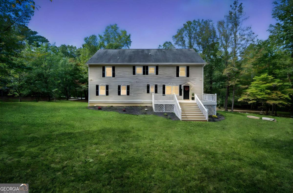 Welcome to your dream home! This beautifully renovated traditional-style residence is nestled on over 2 acres of serene land, complete with a charming creek and ample space for outdoor activities. Boasting a true 6 bedrooms and 4 full bathrooms, this home provides plenty of room for family and guests, along with an unfinished basement that offers even more potential for expansion. The heart of the home is the stunning newly remodeled kitchen, featuring elegant granite countertops, sleek white cabinets, a stylish tiled backsplash, and modern appliances that make cooking a delight. The main level includes a spacious master suite, complete with an oversized walk-in closet and a luxurious master bath that features double vanities, a separate tub and shower, and beautiful tiled floors. Upstairs, you'll find four additional bedrooms, each equipped with generous closets and ceiling fans for added comfort. The property also includes a separate 30x60 DETACHED GARAGE/WORKSHOP with power and two garage stalls, perfect for extra parking, a home office, or a personal retreat. With no HOA restrictions, this fantastic property offers the perfect blend of comfort, functionality, and tranquility. Don't miss your chance to make this exquisite home yours!