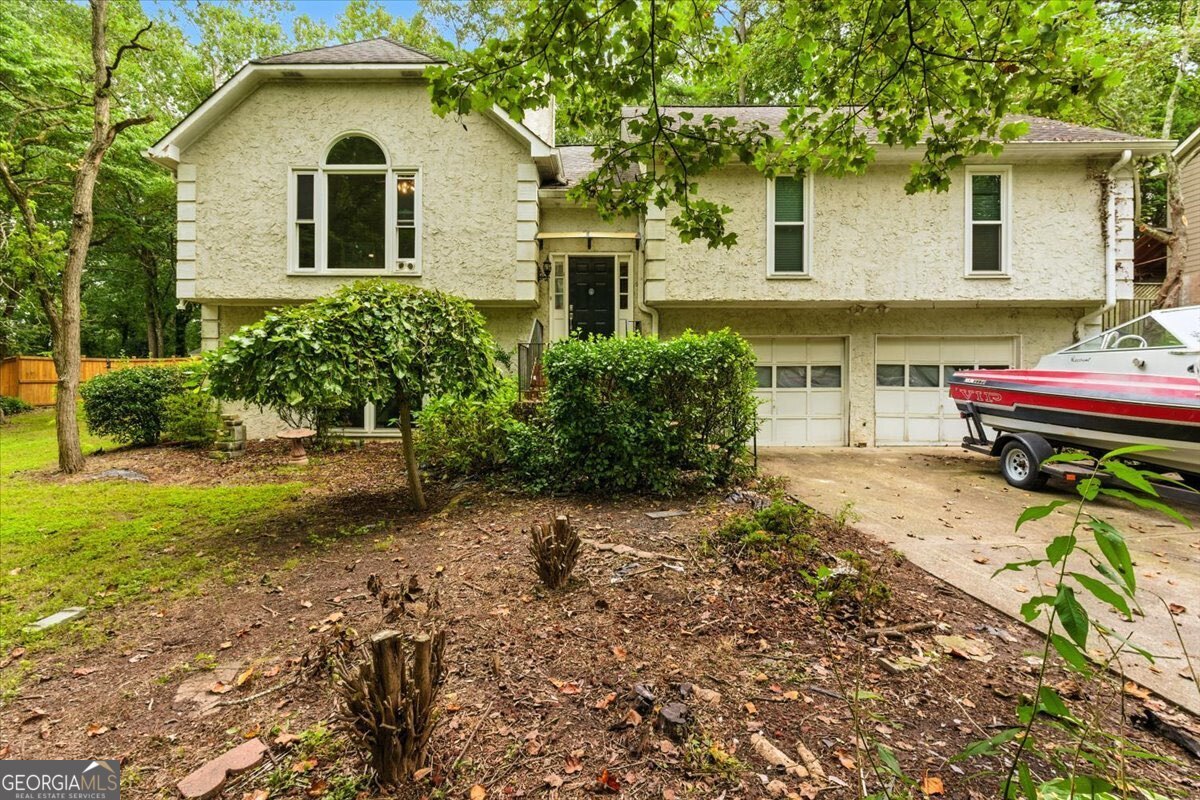 Nestled in a small, quiet neighborhood on a cul-de-sac street, this 4-bedroom, 3-bath home offers an ideal canvas to create your dream oasis in prestigious East Cobb. Located in a truly prime location-just minutes from upscale shopping, dining, and entertainment such as The Avenue, Whole Foods, and more-this property combines tranquility with lifestyle convenience. Inside, you'll find newer windows throughout, filling each room with natural light. The spacious layout offers multiple living areas, while the deck out back overlooks an above-ground pool-perfect for relaxing or entertaining. The garage includes an e-vehicle charging station, providing an effortless charging experience right at home. As part of East Cobb's award-winning school district, this property delivers educational excellence in addition to its exceptional location. Listed under appraised value, this is a rare opportunity to own a hidden gem in one of Atlanta's most sought-after communities-and a chance to realize your unique vision while maximizing its full potential.
