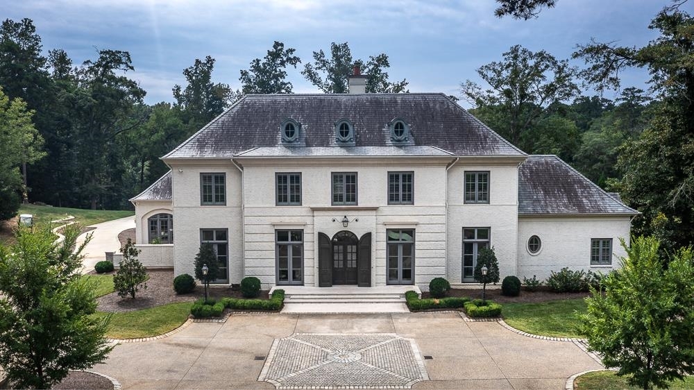 This is a once in a lifetime opportunity to live in arguably the most beautiful home in all of 5 Points! Situated on 1.46 acres with a resort style pool, overlooking the lake where you have the opportunity to build a dock, this exquisite estate embodies the highest quality construction coupled with extensive custom details and high end design features. The barrel ceiling in the family room and other beautiful architectural details such as the floating staircase as well as the gourmet kitchen with its expansive island and top of the line appliances, (in both the main kitchen and butler's kitchen,) wine display cases, marble countertops and marble tile throughout, are just a few of the highlights in this stunning home. You will literally gasp at the size and custom detail of the master bathroom, and be delighted with the expansiveness of all the secondary bedrooms each with ensuite baths and walk in closets that in most other homes would be fit for a master suite. Features geothermal heating & air, providing efficiency, savings, convenience, comfort, and sustainability to this amazing home. The photos, as spectacular as they are, cannot convey the stunning details that can only truly be appreciated by seeing this home in person. Contact us today for a detailed list of all the amazing features of the home and for a private tour!
