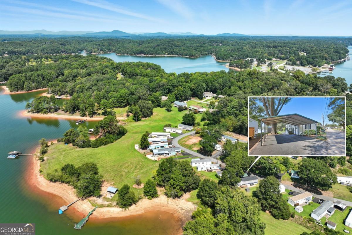 Welcome to lakefront living with unbeatable views! This well-maintained single wide 2005 Horton Homes "Mirage" 14x56 - is situated on a picturesque lake lot in the sought-after Lake Lanier Mobile Home Community. Enjoy peaceful, scenic views of Lake Lanier while being just minutes from Downtown Gainesville, dining & shopping, easy access to I985, and minutes to Northeast Georgia Medical Center. The Lake Lanier Community offers a community dock, as well as a pavilion for residents to enjoy. Located on a leased lot, with a NO rental restriction in place. Lot rental is $635 per month, with a $500 transfer fee to new owner.