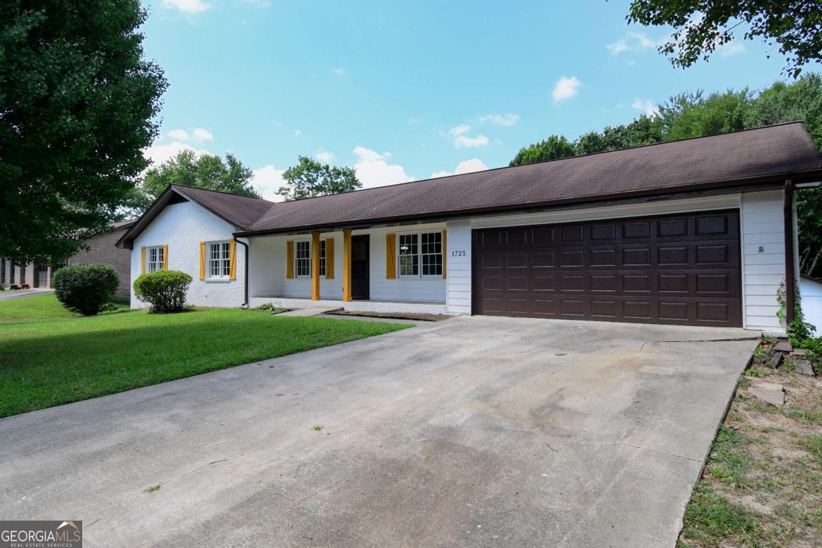 Fully Renovated Ranch with Income Potential in Brookwood School District! Welcome to 1725 Norton Estates Drive-where thoughtful renovations meet timeless charm. This 5-bedroom, 3-bathroom all-brick ranch sits proudly on a spacious half-acre lot with no HOA, offering modern conveniences and flexibility for today's lifestyle. From the curb, you'll immediately notice the enhanced landscaping and welcoming front porch. Step inside to find luxury vinyl plank flooring, updated lighting, and a modern color palette that flows throughout the open-concept main level. The living room features a cozy gas log fireplace, and the stylish kitchen boasts white cabinetry, solid surface countertops, and a full suite of appliances. The main level offers three generously sized bedrooms and two full bathrooms, including a primary suite with a beautifully renovated ensuite bath. Downstairs, the fully finished basement is a game-changer-complete with a full second kitchen, two additional bedrooms, a full bath, and a private entrance. Whether you're accommodating extended family, housing a college student, or exploring rental income, this space is ready for it all. Located in the award-winning Brookwood High School District, the home has been enhanced with new systems, modern finishes, and energy-efficient upgrades. The private backyard includes a covered rear porch that's perfect for morning coffee or evening relaxation. Additional features include a two-car garage, workshop space, and ample storage throughout. All of this in a prime location with easy access to Ronald Reagan Parkway, Hwy 78, top-rated schools, shopping, dining, and recreation. This is more than a house-it's an opportunity. Whether you're looking for a forever home or a savvy investment, 1725 Norton Estates delivers the space, the style, and the setup to fit your future. Schedule your showing today and experience this Snellville gem for yourself!