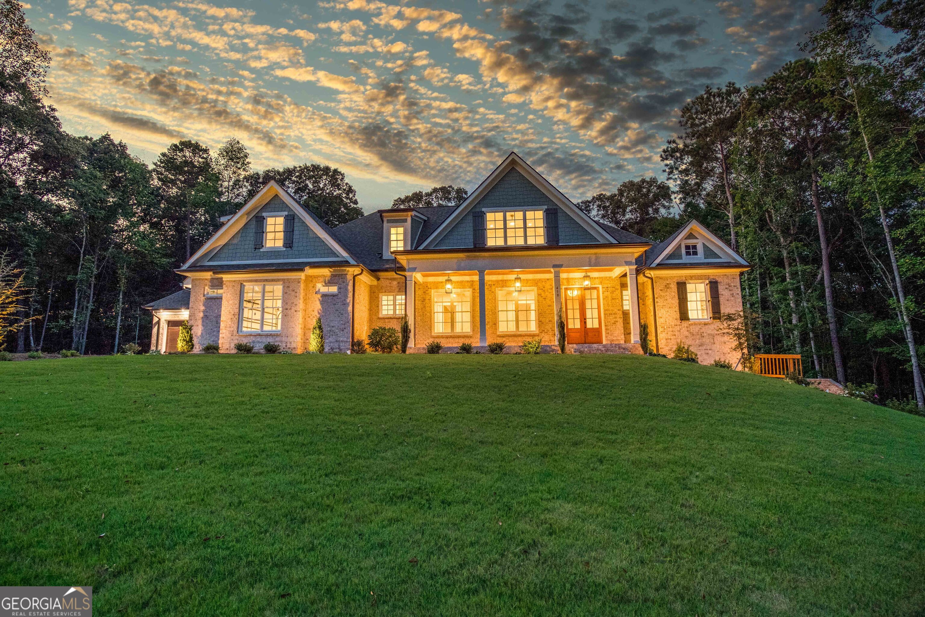 Stunning New Construction on 2.29-Acre Lake Lot in Gated Community! Welcome to luxury lake living in this exceptional 4-sides brick home, nestled on a spacious 2.29-acre lot in a gated community featuring a private boat ramp and pavilion. With the option to build your own dock, this lake lot offers the perfect blend of privacy, functionality, and upscale design. This thoughtfully designed home features 4 bedrooms and 4.5 bathrooms with an open floor plan ideal for entertaining. The chef's kitchen is the heart of the home, boasting a large working island, quartz countertops, custom tile backsplash, farmhouse sink, and high-end stainless steel appliances including a gas cooktop, decorative hood, double ovens, microwave, and dishwasher. The main-level owner's suite is a relaxing retreat complete with a soaking tub, large tiled shower, double vanities, and elegant tile flooring. The formal dining room showcases coffered ceilings, while the spacious family room centers around a beautiful stone fireplace and is accented by soaring floor-to-ceiling windows that flood the space with natural light. Upstairs, you'll find three oversized bedrooms, each with its own private en-suite bath. Additional highlights include hardwood, tile, and carpet flooring throughout, a 4-car garage, irrigation system, and landscape lighting for added appeal. This home offers luxury, space, and the lake lifestyle don't miss your chance to make it yours!