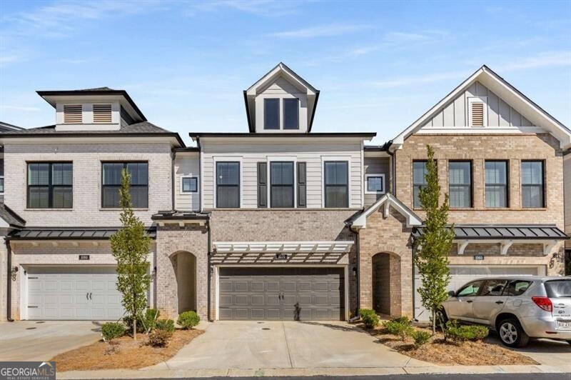 Live in a prime location close to everything. This beautiful 2 story Canterfield plan in an award-winning community by David Weekley lives like a single-family home. Harper Dr. is in the back of the community with no road noise. As you enter the front door into the foyer, you will see how wide the home is and how ample the space is for the living, dining, and kitchen spaces. This home is meant for entertaining! Picture your family and friends interacting with you and each other in the fantastic living space. The white kitchen cabinets are a great contrast to the darker wood island base and white quartz top. The upgraded backsplash was added after purchase. You'll enjoy tons of cabinet and counter space, designer hood with a gas cooktop and stainless appliances. Through the back door, you will enjoy the spacious covered back patio overlooking a nice sized fenced backyard, rare in many townhome communities, and perfect for your four-legged friends! You can even enjoy hearing the church bells that ring every hour from the church across the street! As you climb the wide staircase, you will see the large landing, which is great for art display, an office, or a sitting area. To the right you will find two nice guest rooms and the guest bath with tile flooring and quartz countertops. Across the landing, you will enter your oasis. This oversized primary bedroom has plenty of room for all your king-sized furniture and across from the bed area, put a comfy sitting area with the tv mounted there. The primary bathroom features updated tile floor, quartz countertops, a beautiful soaking tub and a large tiled shower. What a great place for you to retreat! Another nice addition is the screened porch off of the primary bedroom. Set up your wine fridge up there and relax after the end of the day! The laundry room is on the second floor. This community has a great pool area, great neighbors who all walk their dogs, and talk. The dog park is perfect for letting your pets release energy and best of all, this location is only 2 miles from downtown Roswell and 2.5 miles from Downtown Alpharetta! Get in now. You will love this way of living!