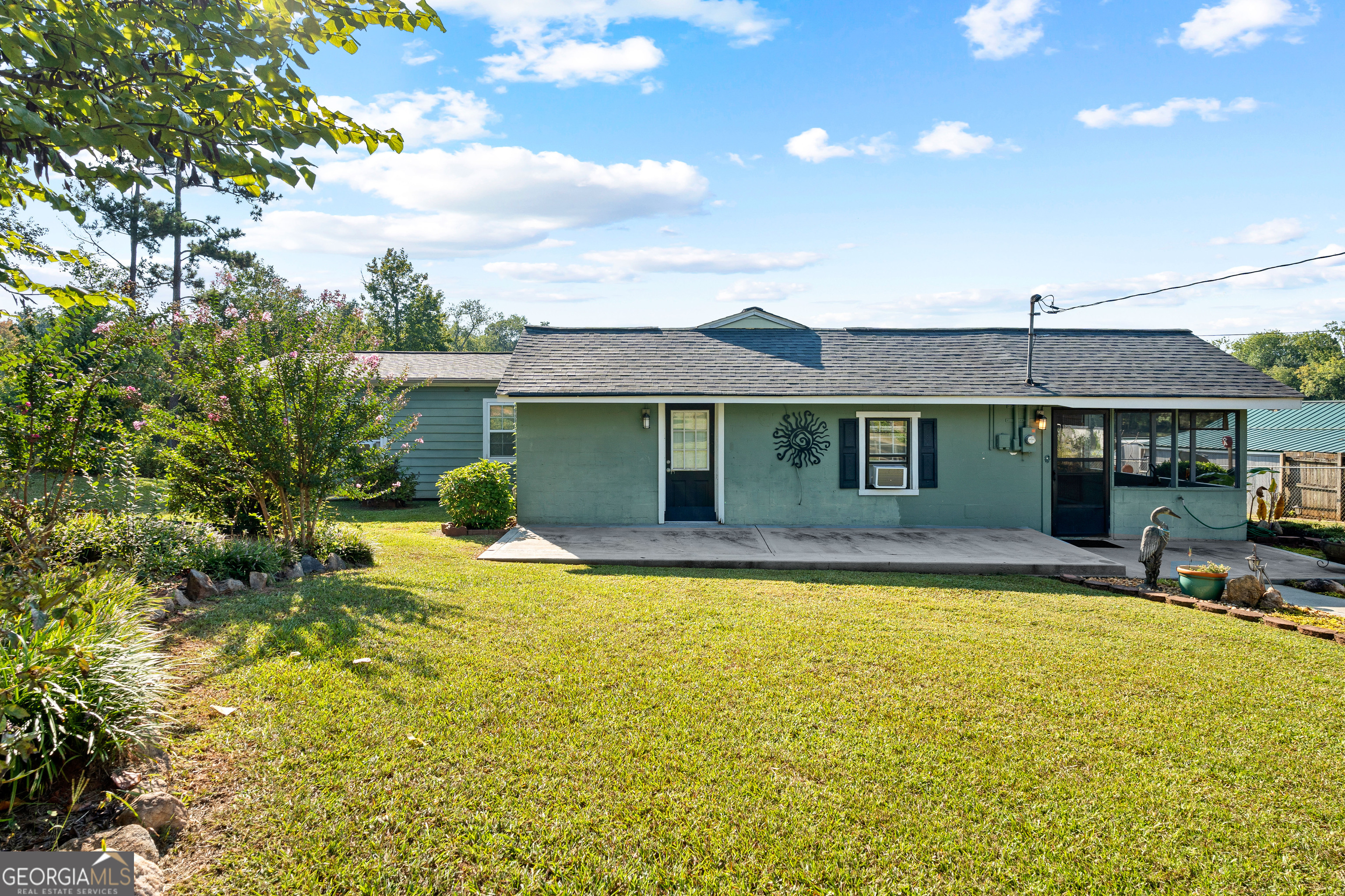 Welcome to lakeside living at its best! This 3-bedroom, 2-bath home on a level, deeded lot offers 1,560 square feet of comfort and functionality on beautiful Jackson Lake. Set on .65 acres, the property provides both space and convenience, with a private dock that makes it easy to enjoy the water anytime you choose. Step inside to find a flowing layout designed for relaxation and connection. The living spaces are open and inviting, while the screened porch extends your living area outdoors, perfect for morning coffee, casual meals, or quiet evenings taking in the fresh air. The primary suite includes a walk-in tile shower, offering both style and ease of use. Two additional bedrooms provide flexibility for guests, a home office, or hobbies. Natural light throughout the home enhances its welcoming feel, while thoughtful finishes add comfort to every room. Outdoors, the property shines with its level lot and direct access to the lake. The private dock is ready for boating, fishing, or simply soaking up the views. With a lot that's both manageable and spacious, you'll have room to gather, garden, or play without feeling overwhelmed. Located in Jackson, GA, this home combines the tranquility of lakeside living with the convenience of nearby amenities. Whether you're looking for a full-time residence or a getaway retreat, it's a property designed for enjoying life at the water's edge. Don't miss the chance to make this lakefront home yours. Schedule a showing today and experience all that 180 Cove Rd has to offer.