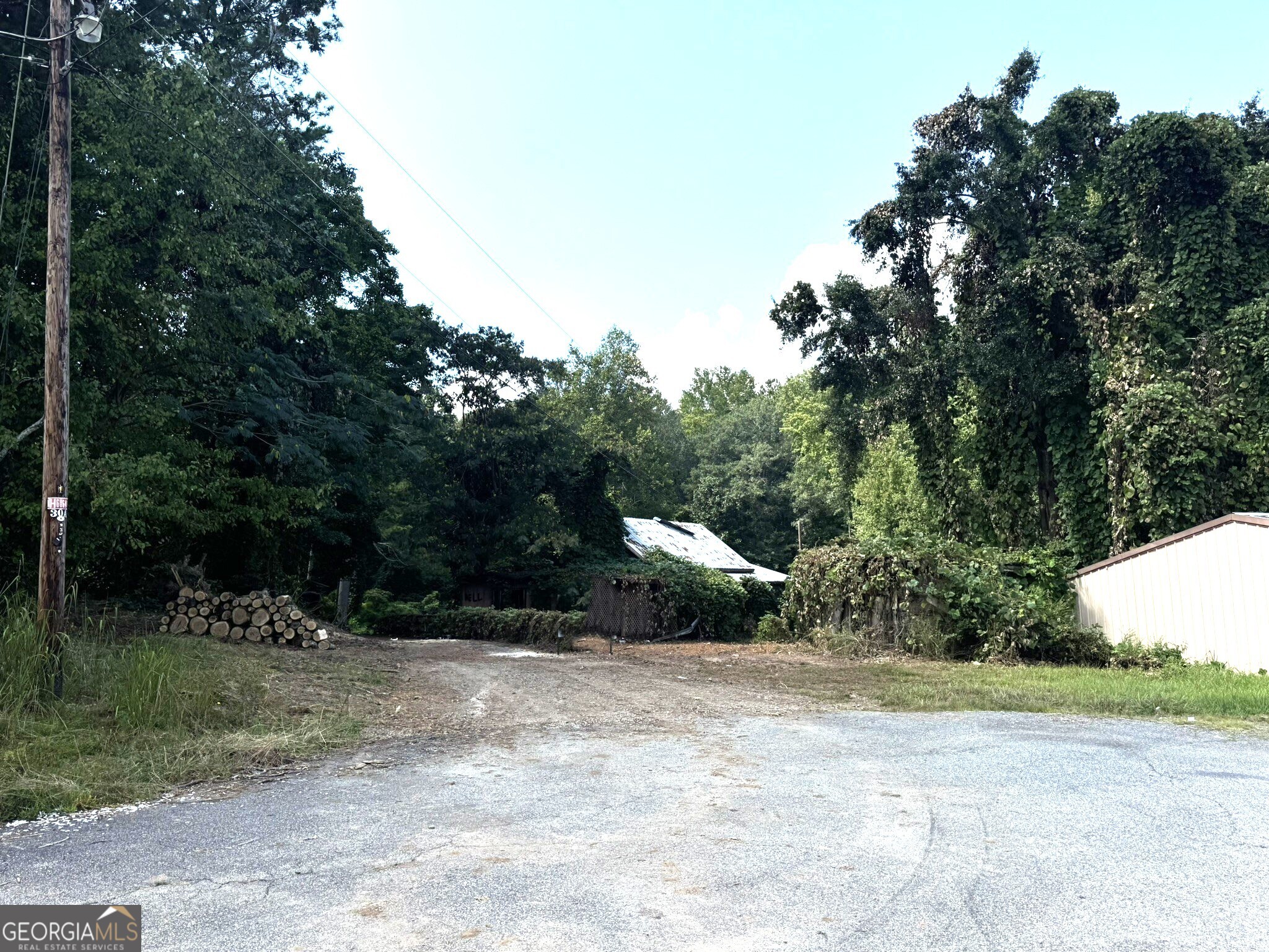 A .76 acre Lot in Downtown Dawsonville. The lot is currently zoned CBD (Central Business District). The perfect location to build a multi family unit. Sewer and public water is available. Property Adjoins the backside of the dollar general on 53 just above the Dawson County Historic Courthouse. Do not enter the property without an appointment. Do not enter the building on the property as it is unsafe.