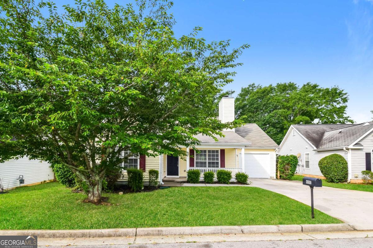 This spacious ranch offers incredible curb appeal and plenty of room to spread out. Step inside to find high ceilings and a bright, open living space that includes a dining room and a cozy fireside family room. A separate breakfast room that leads into the kitchen, which features granite countertops, gas stainless steel appliances, and direct access to the back patio and private backyard. The primary suite includes a large walk-in closet and a private ensuite bathroom. On the opposite side of the home, you'll find two secondary bedrooms that share a bathroom