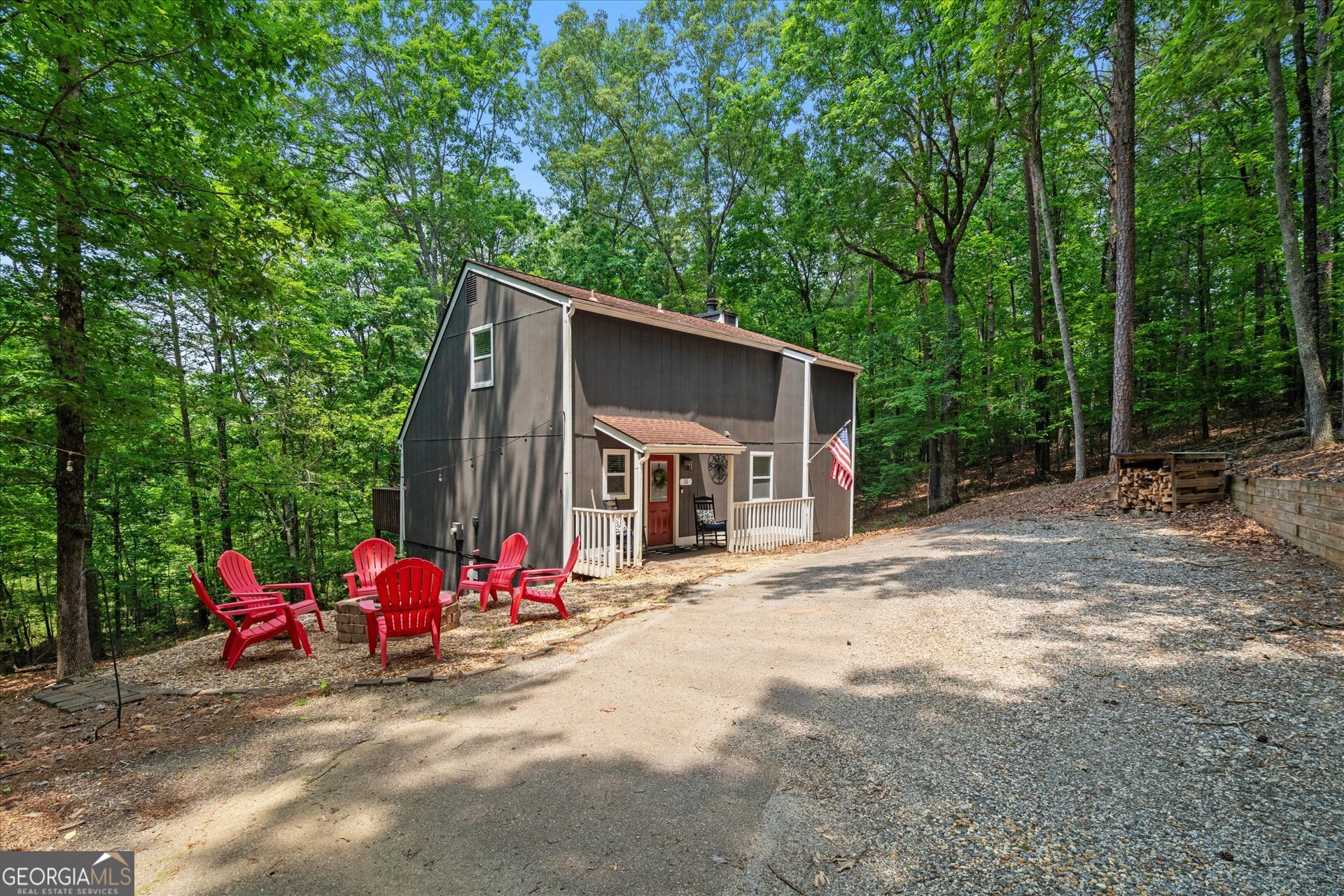 North Georgia Mountain Retreat | 2BR + Loft Welcome to 33 Angelican Way-a beautifully updated cabin tucked into the peaceful hills of North Georgia wine country. Whether you're looking for a personal escape, an STR investment, or a cozy full-time residence, this one checks all the boxes. Inside, you'll find a bright, open layout with vaulted ceilings, hardwood floors, and tasteful finishes throughout. The remodeled kitchen features white shaker cabinets, quartz countertops, a stylish tile backsplash, and stainless steel appliances. The main level offers a spacious bedroom and full bath, while upstairs includes a second bedroom, open loft, and a charming overlook into the living space below. Outside, relax around the firepit, sip wine on the deck, or just enjoy the peace of your private wooded lot with seasonal mountain views. Located in Dahlonega (Cleveland address reflects Lumpkin Co. post office), just minutes from Helen, Blairsville, award-winning vineyards, hiking trails, and waterfalls-this is mountain living at its finest. Bonus: The neighboring cabin at 102 Angelican Way is also available-an ideal opportunity for a dual rental or multi-family setup.