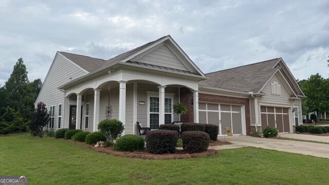 Welcome to this beautifully upgraded 2-bedroom, 2-bath VILLA located in a desirable 55+ community offering exceptional amenities and a low-maintenance lifestyle. With an office and a bright SUNROOM (or flex space), this home offers versatility to fit your needs. It features $20,000 in original builder UPGRADES, plus an additional $35,000 in CUSTOM FINISHES added after closing. Recent improvements include a brand NEW ROOF and GUTTERS, providing peace of mind for years to come. Inside, you'll find engineered wood flooring, pull-out drawers in the kitchen and bathroom cabinets, water filtration system with reverse osmosis in kitchen, and CEILING FANS in every room except the kitchen. Custom shelving enhances every closet, while the laundry room has been thoughtfully upgraded with cabinets and a custom folding shelf. The garage includes ample built-in shelving, and the family room is anchored by a stunning custom built-in entertainment center. The HOA covers EXTERIOR MAINTENANCE and LAWN CARE, along with access to a wide array of resort-style amenities designed for active adult living.All that's left to do is move in and make it your forever home!