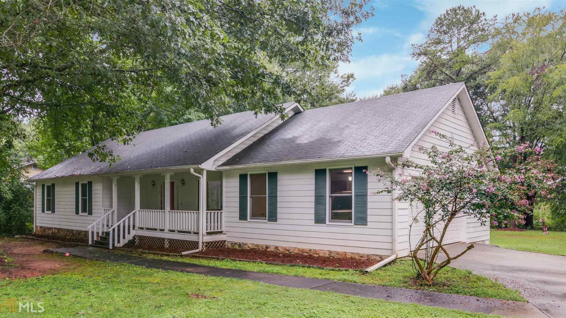 Move-in ready ranch home in convenient Stockbridge location! Home features a rocking chair front porch w/ swing, a formal dining room w/ beautiful oversized window, kitchen w/ stainless appliances & pantry, eat-in breakfast area with bay window & family room w/ vaulted ceilings. From the family, open the french doors to the deck overlooking a large, level backyard. Perfect for kids, pets, etc. Spacious owner's suite w/ large walk-in closet, bath w/ garden tub & separate shower. 2 car attached garage w/ storage space. PLUS an additional over 1000sqft detached garage w/ electricity. This could hold an additional 2 vehicles. It could also be the perfect man cave, workshop, gym, office, etc. The possibilities are endless! Roof only 7 yrs old, newer HVAC & water heater. Hurry! Call now to schedule your appointment.