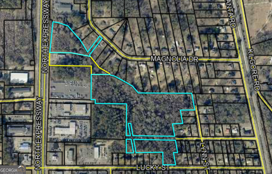 We're thrilled to present this exceptional commercial development opportunity with unbeatable visibility and exposure along HWY 1941 in Griffin. Located in a high-traffic area with over 36,200 vehicles passing daily, this lot offers outstanding potential for your next business venture. This property has 3 sections of land all under one tax record. If you are looking to expand or break ground on something new, this is the ideal location to make it happen!