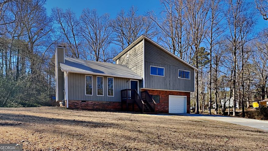 This is a newly renovated 1 car garage 4 bedroom 2 bath split level home with a covered deck on a spacious lot. The residence comes with new carpet, new exterior & interior paint, new garage door, new hvac system, new vanity, contemporary lighting and luxury vinyl flooring. The kitchen has granite countertops, new cabinets, a stainless steel dishwasher, microwave and stove. The main level has a vaulted ceiling, your entertainment, kitchen and dining area. The lower level has a bedroom, full bath, garage access and laundry area. The primary bedroom, full bath and bedrooms are on the upper level. The covered deck awaits you to deem worthy of your favorite outdoor chill spot ! Come feel brand new with this home after its makeover ! Check it out and place your offer !