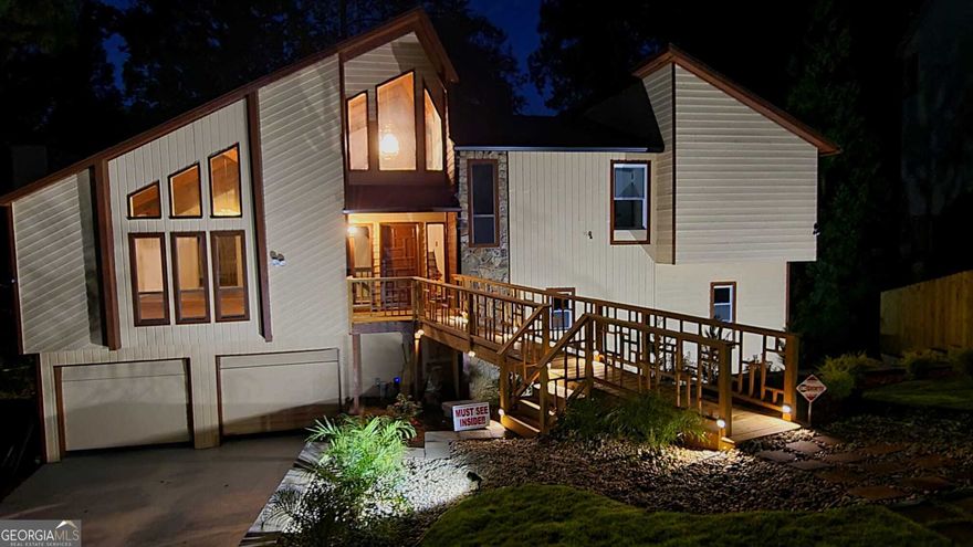 For 24/7 immediate personalized open house, Text / Call 470-275-7887 or 678-234-2817. This house is nothing short of a paradise.  As of 10/2025 it's an all-new home from floors to ceilings and everything in between, inside/out with a $200,000 renovation on,  by far, the best and the most beautiful lot in the highly desirable $1,000,000 - East Cobb community, East Spring Lake, a hidden gem, where all homes sell within days.   Seriously, this is a once-in-a-lifetime opportunity. As one of the last top-quality contemporary homes built in North Atlanta area, it offers spaciousness and brightness with modern simplicity unmatched by any home being built today.   This 4-5 bedroom jewel with 3 amazing shiny-new baths will be the envy of all your friends and family forever.  After all, whom do you know who falls asleep with the sound of a peaceful fountain in their bedroom or office, who cooks on movable kitchen island on wheels with brakes in a sun-filled kitchen on counters tops that shimmer with the rays of sunlight reflected in crystals, and who can house important family or friends in an incredible in-law suit with marble bathroom and a large steam room, incredible lake-side family room with a deck and a special walkway to the private pond with a fountain as a private retreat for a shady afternoon beer or tea.   No person who has ever entered this home ever forgotten it, and neither will you.