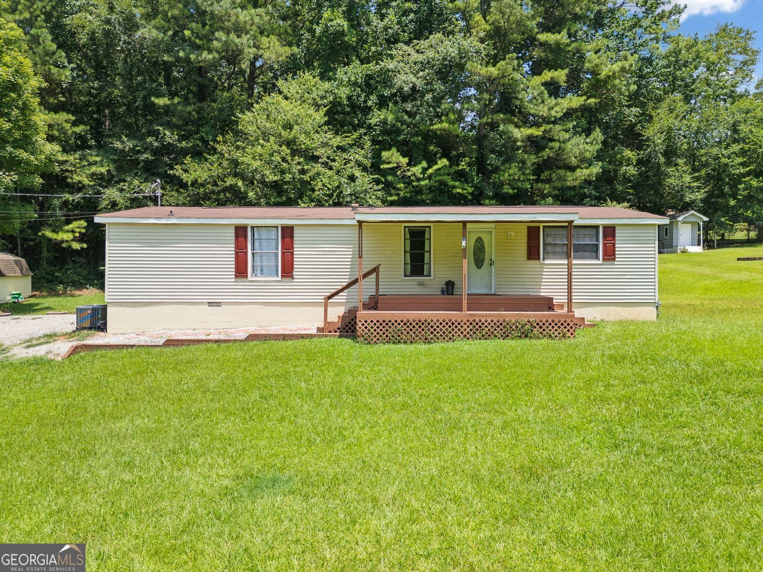 Welcome to this charming 3 bedroom 2 bath home just steps from the shores of Lake Allatoona and the popular Holiday Harbor Resort and Marina. Tucked into a peaceful neighborhood, this home is the perfect blend of cozy comfort and lakeside lifestyle. This property is perfect for a primary home, a weekend getaway, or an Airbnb investment. Step inside to see a brand new kitchen. It has stylish finishes and modern appliances. The whole interior is refreshed and inviting. Enjoy the look and feel of all new flooring throughout the home. The new HVAC system keeps the space comfortable year-round, and new exterior doors offer peace of mind and curb appeal. Set on a spacious lot, there is plenty of room for gardening, outdoor entertaining, or simply relaxing in the open air. Three outdoor decks provide the perfect place to soak up the sunshine, sip your morning coffee, or gather with friends after a day on the lake. A backyard shed offers additional storage space for your lake toys, tools, and seasonal items. This home is perfect for those who love boating, fishing, and waterfront fun. It offers a laid-back lake lifestyle close to metro Atlanta. Don't miss the opportunity to own a move-in ready home near Lake Allatoona with income-producing possibilities. Schedule your showing today and experience this inviting property for yourself.