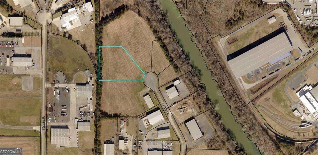 Great industrial flat lot, approx. 3.06 acres cul-de-sac, regional detention in place. Many possibilities! Georgia Power and county water available. Lot will require a septic tank.