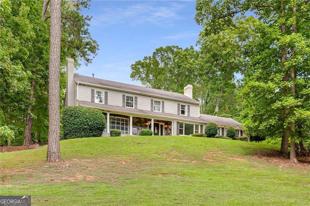 Located in the heart of Sandy Springs, 2660 Spalding Drive offers 4 bedrooms, 3.5 baths, a finished basement, and a spacious layout ideal for comfortable everyday living and entertaining. A large formal living room just off the foyer sets the tone-perfect for guests or flexible enough to open to the kitchen. The sunroom provides a quiet retreat with views of the private, landscaped backyard. The bright white kitchen features an island, breakfast nook, and flows seamlessly into the open dining area. The cozy family room is filled with natural light and anchored by a fireplace. Upstairs, you'll find the owner's suite with a walk-in closet and a double vanity bath with a walk-in shower, along with two additional generously sized bedrooms-each with access to its own bathroom-and a convenient laundry room. The finished basement includes a full bedroom, providing ideal space for a guest suite, media room, or home office. Outside, enjoy a patio and large backyard-perfect for relaxing or entertaining. All just minutes from Dunwoody Village's shops and restaurants, with easy access to GA-400 for commuting or weekend getaways.