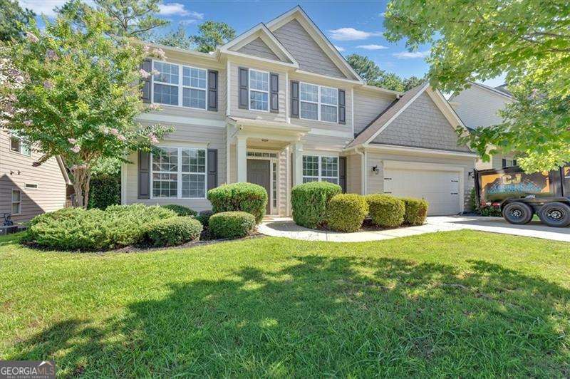 Welcome to Lakestone! This beautifully remodeled home is filled with natural light and thoughtful details throughout. Step into the bright two-story living room, where oversized windows and a cozy fireplace make it the perfect gathering spot. The main level offers both formal living and dining spaces, plus a freshly updated half bath. Just outside, a covered patio overlooks your private fenced backyard...the kind of space that makes morning coffee and evening unwinds feel like a retreat. Upstairs, you'll find a spacious owner's suite with room to relax, along with three additional bedrooms and a full bath. Every inch of this home has been lovingly updated-just move right in. Set in the heart of Lakestone, you'll enjoy access to all the neighborhood favorites: a sparkling pool, tennis and pickleball courts, a playground, and even a scenic lake with catch-and-release fishing. With sidewalks throughout, top-rated schools, and an unbeatable location just minutes from Downtown Woodstock and Downtown Roswell, this one truly checks all the boxes.