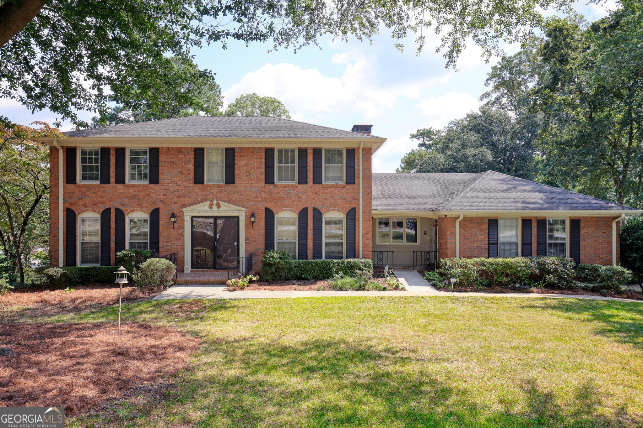 Please schedule to see this custom built, original owner since 1976. Four sided traditional brick home in the prestigious Bennett Woods community. The home showcases classic architectural details from an era that featured solid construction, and timeless design elements. Large windows allowing beautiful natural sunlight to fill the spacious five bedroom home, while the original fixtures and finishes offer a nostalgic touch. The property includes a professionally landscaped yard with fig trees, well established bushes on a beautiful lawn that complements the homes enduring character and inviting ambiance. This home is the very essence of quality construction whether a buyer renovates or if one loves the charm and originality of mid century design.