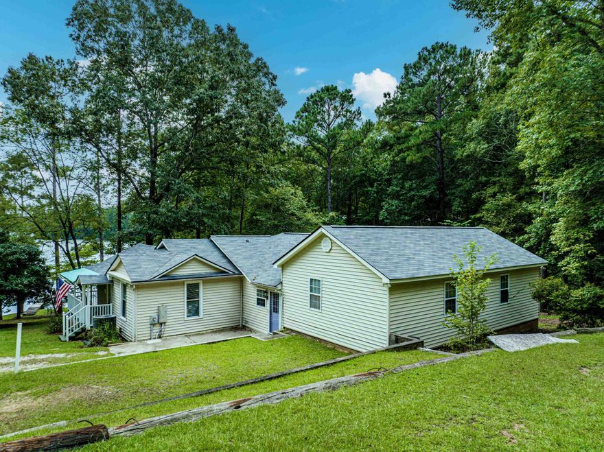 Adorable! Affordable! Original owner. 3 bedroom/bath with a charming personality. The floor is designed perfectly with views of Lake Sinclair. All furnishing with a few exceptions convey with property. Pontoon Boat conveys as well! The perfect Lake Getaway!!!!