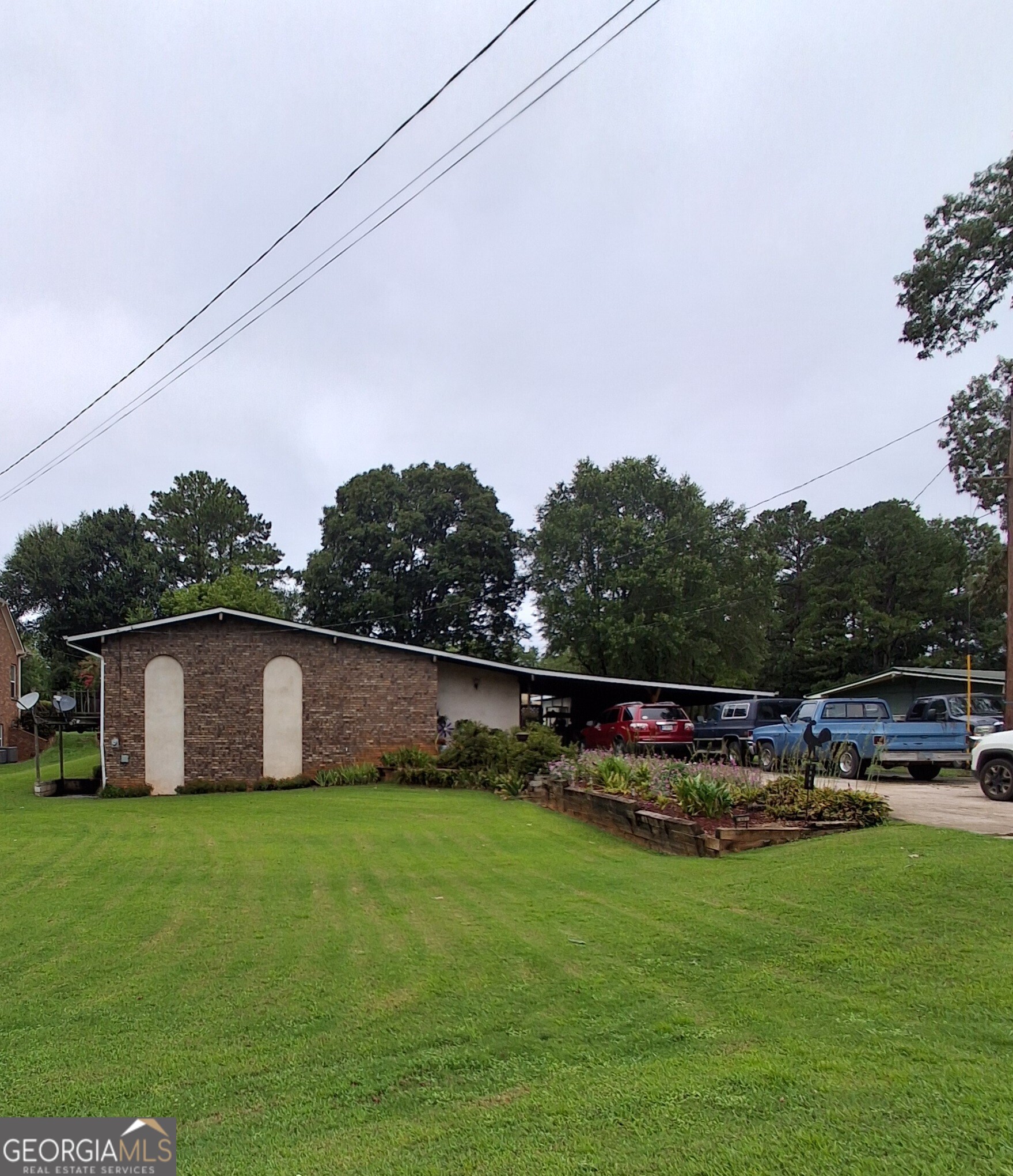 Charming Ranch-Style Home with Pool on Spacious Lot in Marietta. Welcome to 2901 Davis Rd, Marietta, GA 30062 - a 3,070 sq ft single-family ranch home nestled on a generous 0.77-acre lot. Featuring 5 bedrooms and 3 full bathrooms, and finished basement this property offers ample space for families of all sizes. Enjoy relaxing or entertaining in your private backyard, complete with a lovely in-ground pool and peaceful outdoor seating areas. This home is located in an up-and-coming area known for its strong community and excellent school district - a perfect setting for both comfort and growth. Sold As-Is - A great opportunity for buyers or investors looking to personalize and add value. Don't miss this chance to own a home with great bones, a large lot, and fantastic potential in East Cobb!