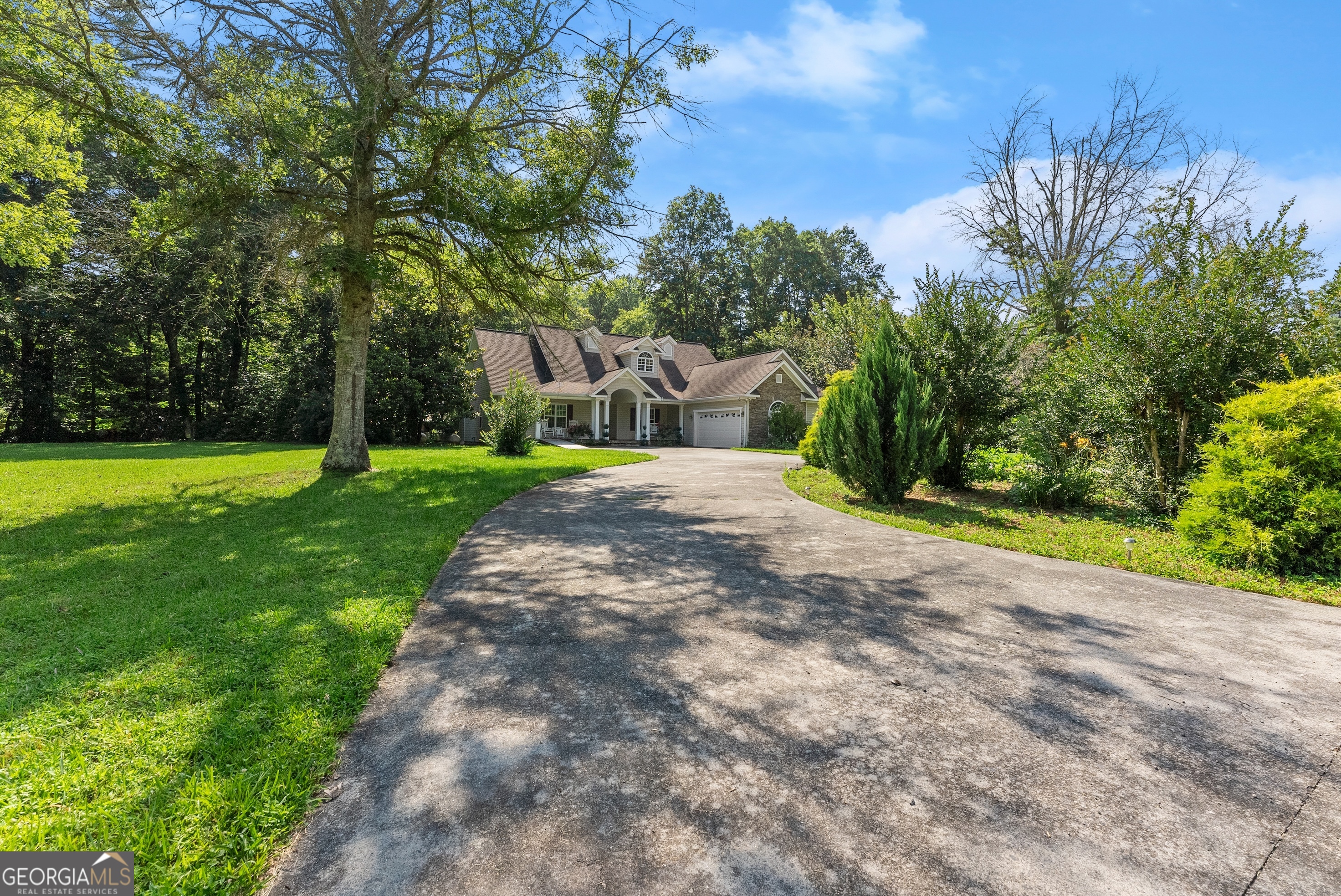 Welcome to your home in the mountains, nestled right on the scenic Hiawassee River in the highly desirable Hi River Country community. This custom-built, one-owner home features 4 bedrooms, 3 full bathrooms, and 2 half bathrooms, designed with comfort and mountain charm in mind. Step into the spacious sunroom overlooking a platform deck and the river-perfect for relaxing or entertaining. Enjoy a flat backyard with a cozy outdoor gazebo, ideal for cool evenings by the water. The property includes a 2-car garage and a circular driveway for added convenience and curb appeal. Located in a beautiful paved road neighborhood known for its stunning homes and peaceful surroundings, Hi River Country offers exclusive private river access for riverfront homes only, featuring a mile-long stretch of stocked waters perfect for trophy trout fishing. Just minutes from Downtown Hiawassee, Helen, Harrah's Cherokee, Bald Mountain, Lake Chatuge, and the Appalachian Trail -- this home is ideal as a full-time residence, short-term rental, or weekend getaway. Schedule your showing today!