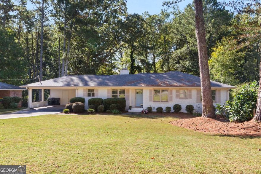 Beautifully Renovated Roswell Ranch on a Large Private Lot.  This stunning renovated ranch sits on a spacious lot and features a finished basement perfect for a flex space or optional fourth bedroom. Thoughtfully updated from top to bottom, this home includes a newer roof and gutters with gutter guards (2023), HVAC (2023), water heater (2023), windows (2023), appliances (2023), and new lighting throughout. The kitchen shines with new cabinetry, quartz countertops, and tile backsplash, while real hardwood floors flow throughout the main level. Both the primary and secondary bathrooms have been fully renovated, showcasing walk-in showers with seamless glass doors. Relax by the cozy fireplace in the keeping room, or entertain guests on the screened-in back porch-the perfect spot for watching the big game. Step out onto the back deck and enjoy the huge, private, fenced backyard. Conveniently located just minutes from Downtown Roswell's restaurants and shops, and zoned for top-rated Roswell schools-North Roswell Elementary, Crabapple Middle, and Roswell High.