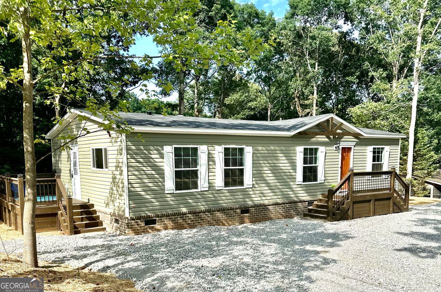 This 3 bedrooms, 2 bath, open floor plan home has custom wood treatments throughout the interior and exterior. (no plastic shutters here). From an all-Brick Foundation, Heat Pump, OSB wrapped exterior, up-graded insulation, energy efficient windows, Stainless-Steel appliances, remote-controlled fireplace with built in entertainment center and a programmable thermostat; no expense was spared to provide an energy efficient, low cost living experience. This unique and custom home has a permanent foundation that will pass all FHA, VA and Conventional Finance Standards, and comes with a 1-year home Warranty. See attached pictures for the attention to details that separates a Progressive Home from all the others. Preferred Lender, James Maddox/ First Heritage Mortgage and Preferred Closing Attorney, Russell C Petersen.