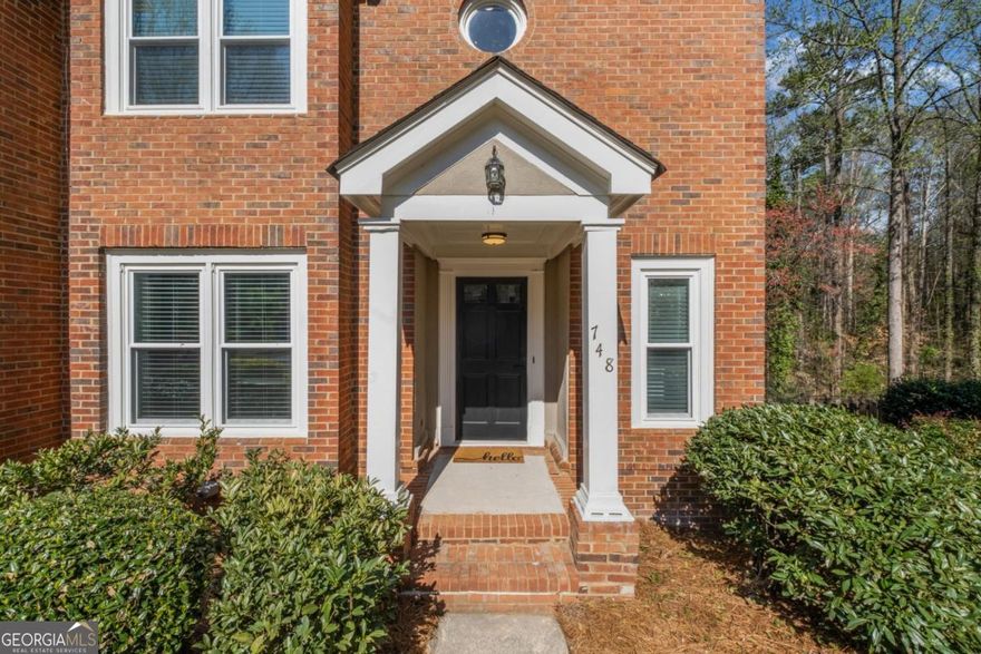 Welcome to this STUNNING & FULLY REMODELED townhome located just steps from Olde Towne Athletic Club. You are going absolutely love the LOW MAINTENANCE luxury vinyl plank flooring throughout the entire home (NO CARPET) and the light and bright floorplan. Cooking is a breeze in the chef's kitchen complete with new stainless appliances and beautiful quartz counters. The fireside living room is located on the back of the home, is extremely spacious and overlooks the wooded natural area (perfect for wildlife watching). Upstairs you will find a perfect roommate floorplan with a primary suite that features his/her closets and a REMODELED BATH + second guest room with en suite remodeled bath. Laundry is also conveniently located on the upper floor. The terrace level is home to a 2 CAR GARAGE and a small finished area that would be perfect for storage or a home office. NEW WINDOWS, NEW ROOF, NEW WATER HEATER, and EVERY SURFACE REMODELED = MOVE IN READY for you! Located in the coveted Walton school district and just a few minutes to GA400 and I-285, this place is A PERFECT 10 and you are absolutely going to love it here. WELCOME HOME!