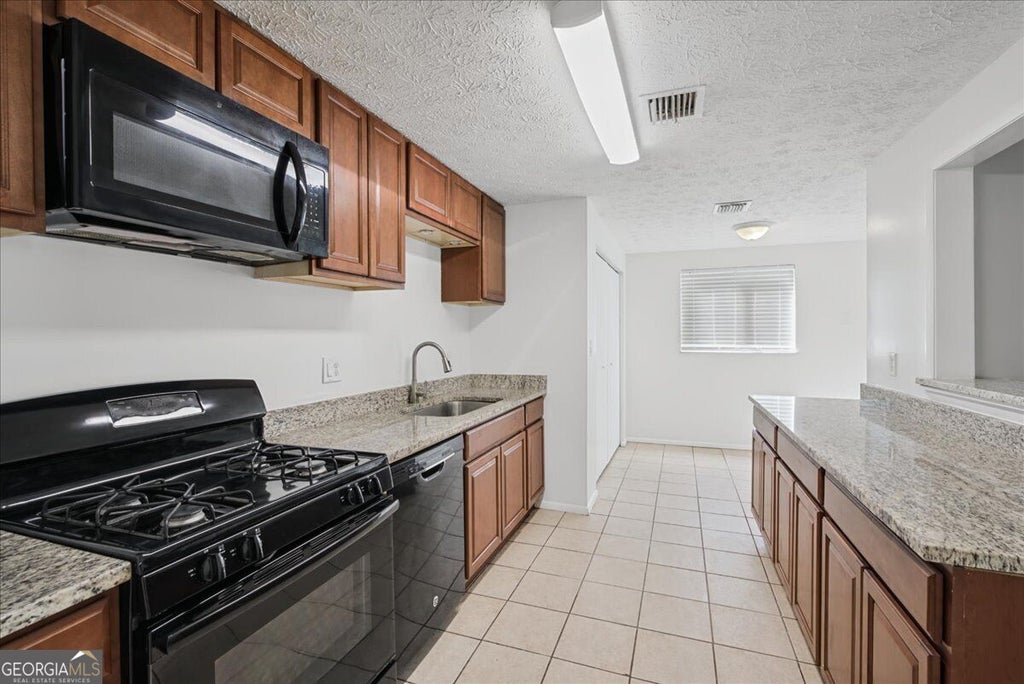 Photo of 1321 Muirforest Drive, Stone Mountain, GA 30088 (MLS # 10852078)