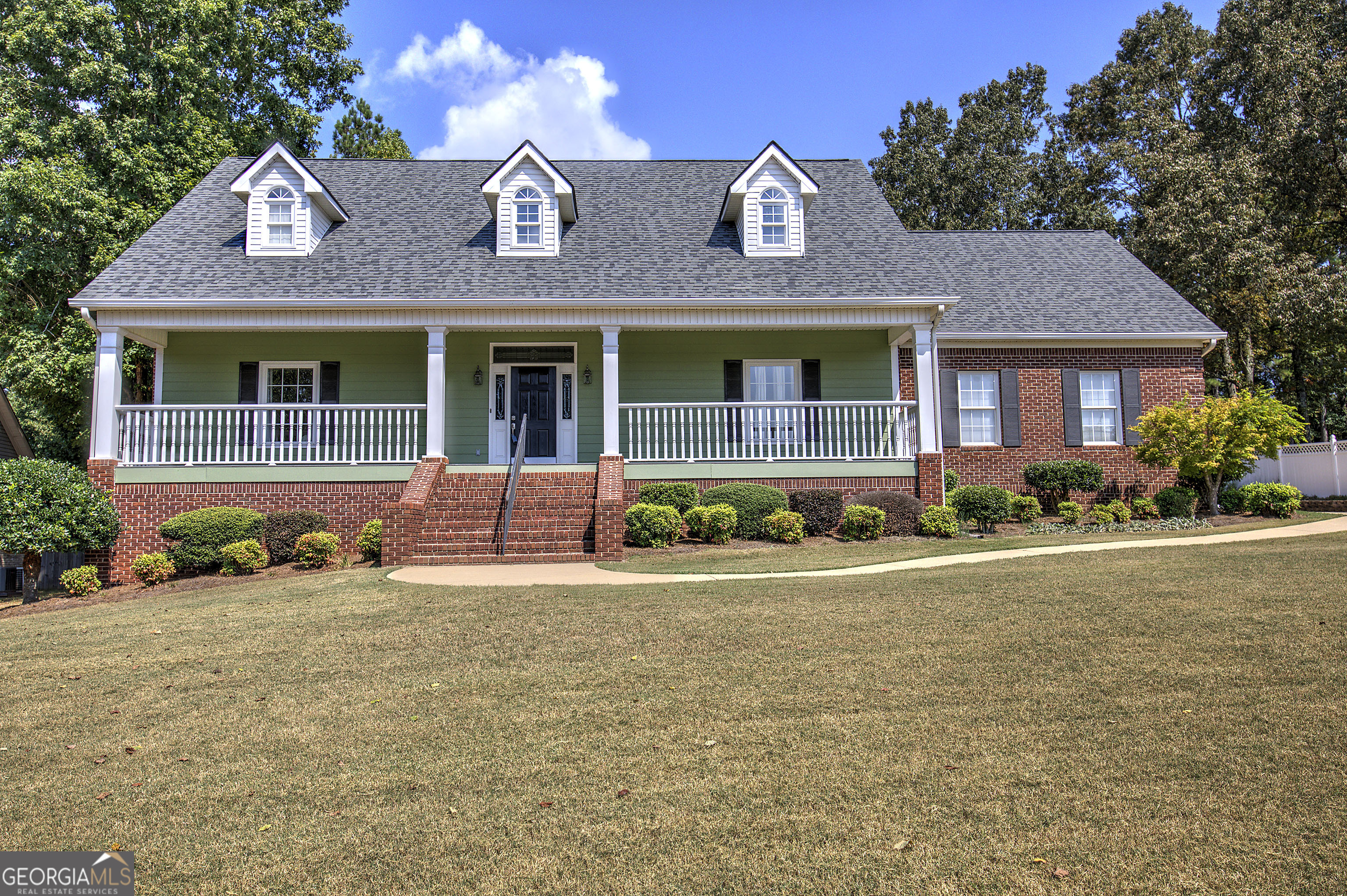 Welcome to this beautifully maintained 3-bedroom, 2.5 bathroom custom-built home, thoughtfully designed to offer comfort, functionality, and timeless curb appeal. From the moment you arrive, the large front porch creates a warm and inviting first impression, perfect for enjoying your morning coffee or greeting guests. Inside, you will find a spacious layout that blends traditional style with modern living. A cozy yet spacious family room serves as the heart of the home - ideal for relaxing evenings, entertaining, or spending time with loved ones. The formal dining room provides a comfortable setting for hosting dinners and special occasions, while the eat-in kitchen offers the perfect space for casual meals and everyday family gatherings. The split bedroom floor plan provides both privacy and convenience. The additional bedrooms are connected by a Jack and Jill bathroom and a 3rd sink for guests, making the home both functional and family-friendly. The primary suite is tucked away for peace and quiet, featuring its own private bath with double vanities, soaking tub, separate shower, and a large walk-in closet. Step outside to enjoy an abundance of outdoor living space. A covered back porch provides a comfortable spot for year-round relaxation, and the large deck offers plenty of room for barbecues, gatherings, or simply unwinding in the fresh air. With two-sided brick construction, this home not only delivers lasting durability but also adds to its classic and sophisticated exterior. Additional highlights include a 2-car garage with ample storage, a new roof (2021), and a new HVAC system (2022) - offering peace of mind for years to come. Situated in a quiet neighborhood within a highly sought-after school district! This home offers the best of both worlds: a timeless design with practical features, all in a desirable location! Don't miss the opportunity to make it yours!!
