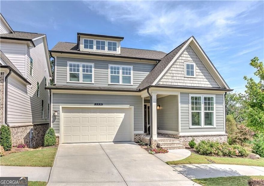 Welcome this immaculate move-in ready home in the inviting neighborhood of Inwood.  This gently lived in home shows like a model with the appeal of a 'lock and leave' lifestyle with upgrades galore! Invite your friends and neighbors to this spacious light-filled entertaining home with an open concept kitchen, fireside family & dining room with 10 foot ceilings and large windows bringing in the outdoors overlooking private views of the trees. The kitchen is appointed with gleaming appliances, vent hood over a 5 burner gas cooktop, gorgeous tile back splash, and beautiful quartz countertops. The large island features a porcelain farm house sink and a trash/recycling pull out. There is plenty of storage in the large custom walk in pantry, soft close cabinets with pull outs, and every detail has been considered. As you enter from the garage, kick off your shoes, hang your keys & jacket then unwind after being met with a mud room complete with hooks, cubbies, and a bench; and, yet another large custom closet. Savor the views of the wooded back yard throughout your day on the deck and covered porch with a morning coffee and bird watching, a peaceful afternoon nap, or the tranquility of dusk with frequent deer sightings.The primary suite is complete with an expansive custom closet attached to the bath with dual sinks, water closet, and gorgeous tiled shower. The laundry room is conveniently located next door with considerable storage in custom cabinets, waterfall countertop for folding laundry over washer/dryer, and a double hamper. The loft area has endless possibilities and another space to customize to your needs whether it be another TV or study area, library, or a den.  Retreat to the terrace level to enjoy movies and football games complete with a wet bar, wine fridge, and walk out to the private patio area. This level boasts a large bedroom with two custom closets and full bathroom for guests.  Plenty of additional space for storage in large unfinished mechanical room as well as two additional spacious closets. The neighborhood amenities include a park with a pavilion, fire pit, grassy area for lawn games, pool, cabana, scattered benches throughout neighborhood, and two dog parks. Pinch yourself as you walk or golf cart from Inwood to quaint Rope Mill Road into the charming bustling town of Downtown Woodstock to enjoy parks, walking trails, concerts in the green or amphitheater, art exhibitions at the Reeves House, the farmer's market, the local theater, and engage with neighbors in town as you dine at local restaurants and shop. Immerse yourself and be part of this growing community. Inwood is tucked away yet close to the outlet mall, Costco, and access to interstate 575.