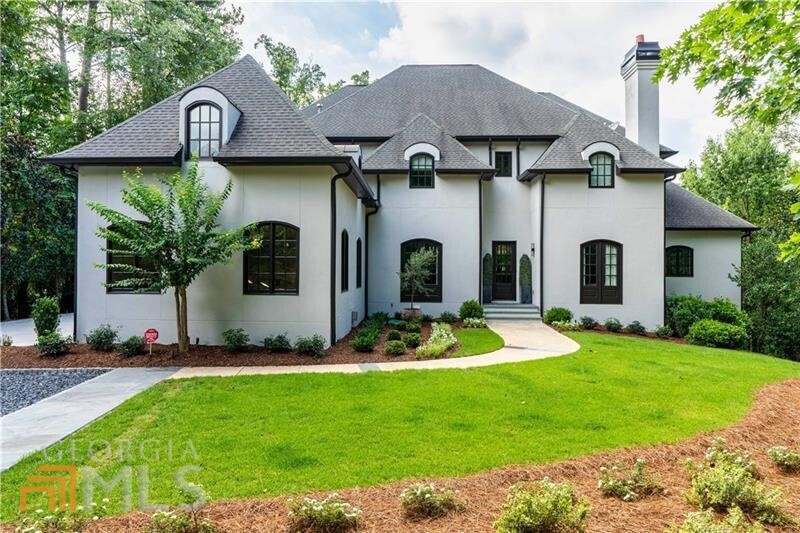 Understated and timeless, this home's French-inspired facade gives way to a stylish, au courant interior and an enviable outdoor living area with multiple decks, patios, outdoor fireplaces, an edge-to-edge infinity pool and a lush backyard. Gorgeous newly renovated, state-of-the-art kitchen with high end appliances, stone topped sleek cabinetry and built-in coffee bar. Truly a home like no other, this is a rare opportunity to purchase a completely renovated, move-in-ready, modern home with the same luxury finishes on all three levels. Enjoy living in the 30327-zip code without the pricey City of Atlanta taxes in this coveted area of ITP Sandy Springs. Magazine-worthy details include soaring ceilings, stone fireplaces, wide-plank hardwood floors and a neutral paint palette and stunning light fixtures.The gourmet kitchen opens to an adjacent fireside family room and a sun-drenched breakfast area with access to the main-level covered porch- complete with an outdoor fireplace. Quiet simplicity reigns supreme in the elegant owner's suite where soft hues evoke tranquility and includes a sitting area, a luxurious bath with a seamless glass shower & multiple shower heads, a freestanding bathtub & a walk-in closet with extensive build outs. Take the elevator to the upper-level or down to the lower where the current owners transformed the space into a second living area. Full bath provides convenience when using the spa as well as the four-sided infinity-edge pool. Surrounding the pool is a wood-burning pizza oven, a firepit by built-in seating, a grilling station, and a large pool deck. Exterior lighting highlights the pool, terraces, home and landscaping- all incredibly private! New driveway with extra parking for multiple cars and turn around. Whole house generator & Savant home automation!