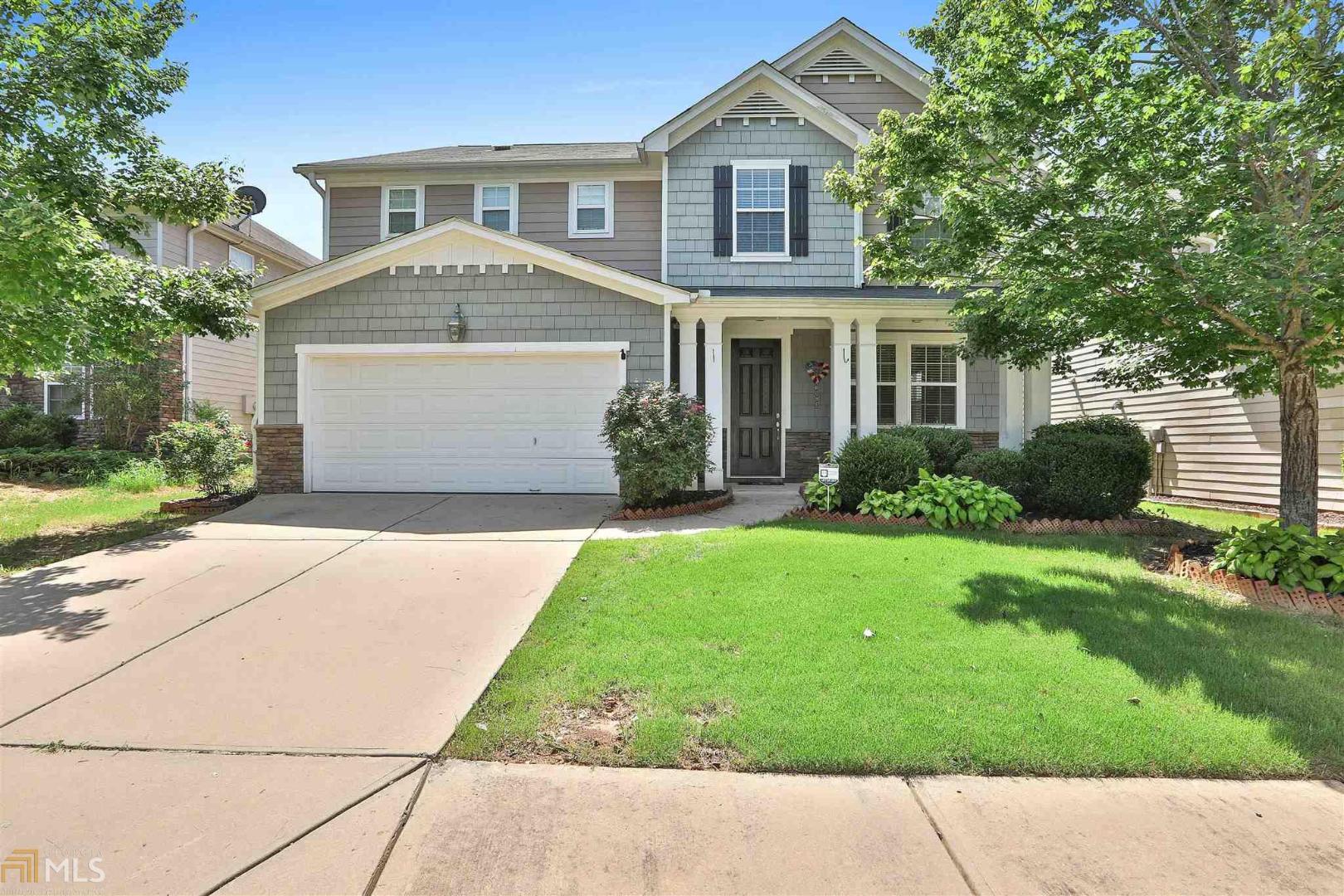Amazing floor plan with well-appointed room sizes. Highly desirable open concept floorplan with hardwoods on the first floor. The downstairs boast an oversized gourmet kitchen/keeping room with work prep island, stainless steel appliances, additional family room, bedroom with full bath on the main level. Master suite has double door entry & trey ceiling with custom closet. Three additional generously sized bedrooms with private baths separated by loft area. Patio and built in fire pit. Swim and tennis community with exercise facility. Located less than 5 miles to Piedmont Newnan Hospital, Shopping, Ashley Park & Cancer Treatment Center and quick access to Interstate 85.