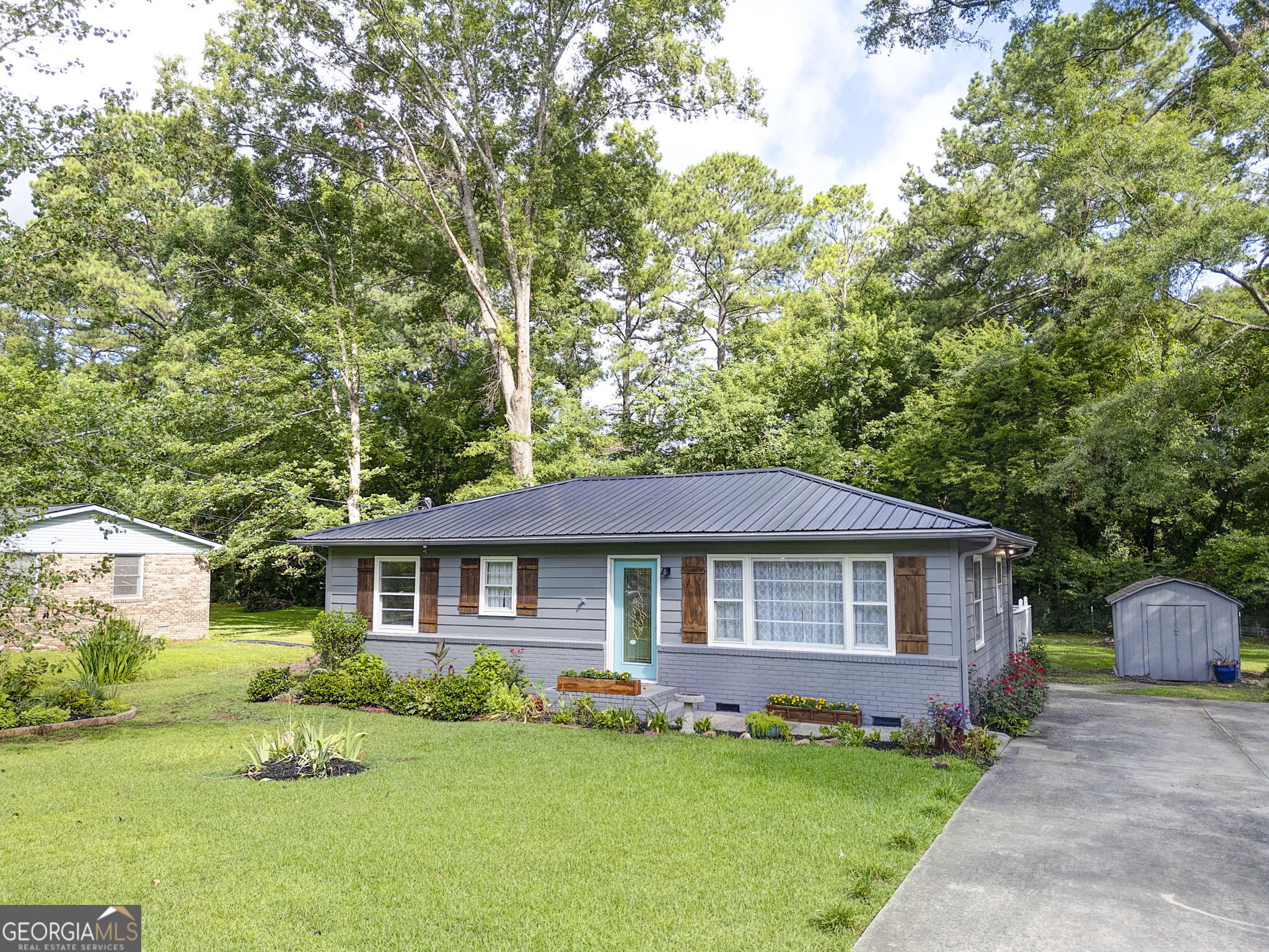 This stunning single-family home offers comfort and modern living with a roof, heating and air, ductwork, and water heater all less than three years old. Enjoy the spacious wrap-around rear deck, perfect for outdoor gatherings, and a convenient storage building for extra space. Inside, you'll find a completely renovated bathroom and an updated kitchen. The beautiful landscaping adds to the home's charm and curb appeal.