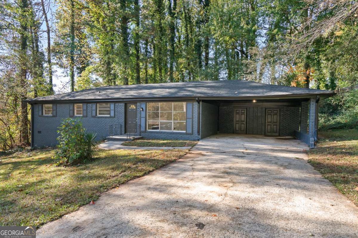 Welcome home to this beautifully renovated 3-bedroom, 1.5-bath brick ranch tucked away on a quiet cul-de-sac just minutes from downtown Atlanta, major highways, and Hartsfield-Jackson International Airport. This light-filled home features a brand-new roof, HVAC system, stainless steel appliances, fresh interior paint, updated bathrooms, and gorgeous hardwood floors throughout. The open-concept living and dining areas flow effortlessly, while the kitchen provides access to a private backyard-perfect for relaxing or entertaining. A covered carport offers convenient off-street parking. Enjoy the ease of low-maintenance living with thoughtful upgrades throughout. Whether you're commuting to the city or working from home, this location offers unmatched access and comfort. Don't miss this opportunity to lease an updated home in an unbeatable location!