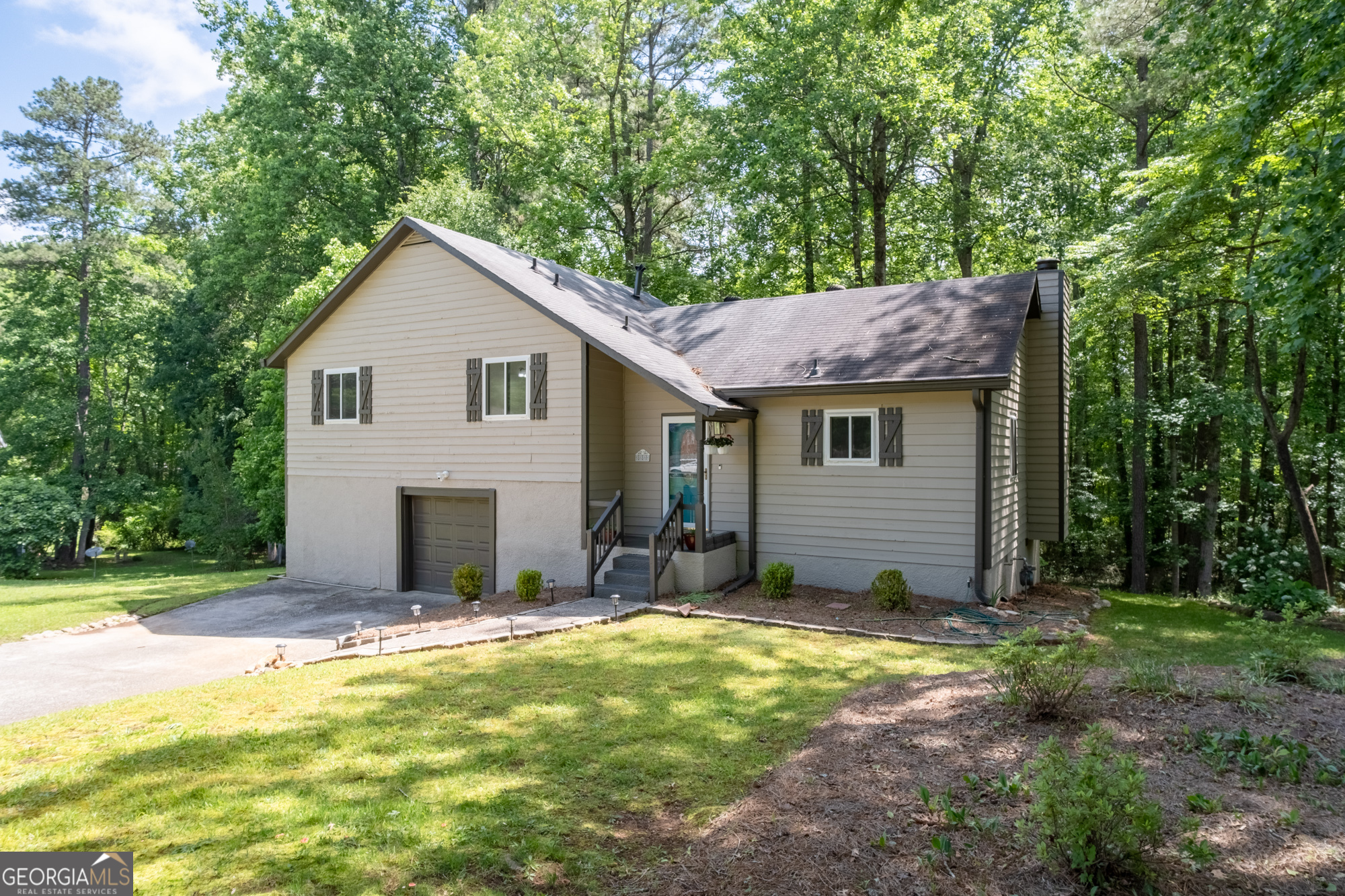 **Welcome to 880 Winfield Court SW - a beautifully updated 3-bedroom, 2-bath ranch tucked away on a quiet cul-de-sac in Marietta.** This charming home offers a spacious and functional layout, featuring a bright living room with vaulted ceilings and a cozy fireplace, perfect for relaxing or entertaining. The kitchen boasts stainless steel appliances, ample cabinet space, and a breakfast nook overlooking the private backyard. The primary suite includes a walk-in closet and an en-suite bath with double vanities. Two additional bedrooms share a well-appointed full bath. Enjoy outdoor living on the large back deck, ideal for grilling and taking in the peaceful, wooded surroundings. Additional highlights include a **one-car garage** and a **washer and dryer included** for your convenience. Located in a well-established neighborhood with easy access to local parks, shopping, major highways, and zoned for sought-after Cobb County schools. **This move-in ready home is a must-see - schedule your tour today!**