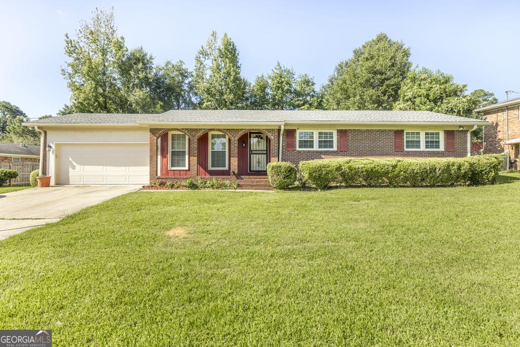 Affordable yet adorable! Welcome home to this well maintained one level brick home situated on a beautiful level lot. This home offers 3 bedrooms and 2 baths, living room/dining room combinations, den , deck, privacy fence, utility/storage house and two car garage. You will enjoy relaxing on the deck or entertaining your company in the backyard. Roof is less than 1 year old and the water heater is only 2 years old.. Don't let this one pass you buy it won't last long. Call today to schedule a showing. " Sold As Is" but will qualify for Fha and VA.