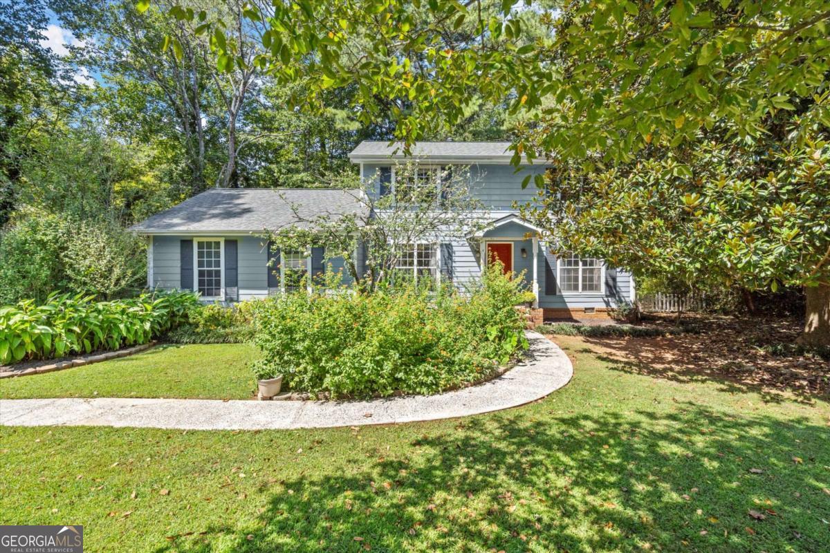 This lovely house is waiting for you to call it HOME. Located in North Landing-a true gem in the sought-after Kell Cluster School district. This 4 bedroom and 2 and a half bathroom home offers so many conveniences! It's located in a quiet cul-de-sac, on a beautifully landscaped garden and a very large fenced flat lot. Enjoy the lovely butterfly garden and entertain your family and friends on the recently maintained and painted back deck. The main level offers a living room and a family room, a breakfast area and a separate dining room, a walk-in pantry and laundry area next to the spacious kitchen. A convenient flex room that can double as a bedroom or an office right next to the bathroom completes the first level. The three bedrooms upstairs are spacious, especially the oversized primary bedroom, which can accommodate a sitting area for your end of day relaxation time. Here are the latest improvements: Updated bathrooms, including tiled floors. Hardwood and LVP flooring through out. New HVAC installed in 2023, and was recently serviced. New roof installed 4 years ago and bathrooms updated in 2018. The North Landing community offers a VOLUNTARY HOA! Amenities include a 14-acre lake for fishing, a salt water pool, two lighted tennis and pickleball courts, extensive grounds, an 18-hole Disc Golf course, children's play areas, and a Clubhouse, which is available for rentals. For more information on voluntary HOA: northlandinghoa.com This charming home is conveniently located close to top rated schools, shopping, entertainment, and access to main highways I-75 and I-575. It is truly a wonderful opportunity at a fantastic price. Don't miss it!