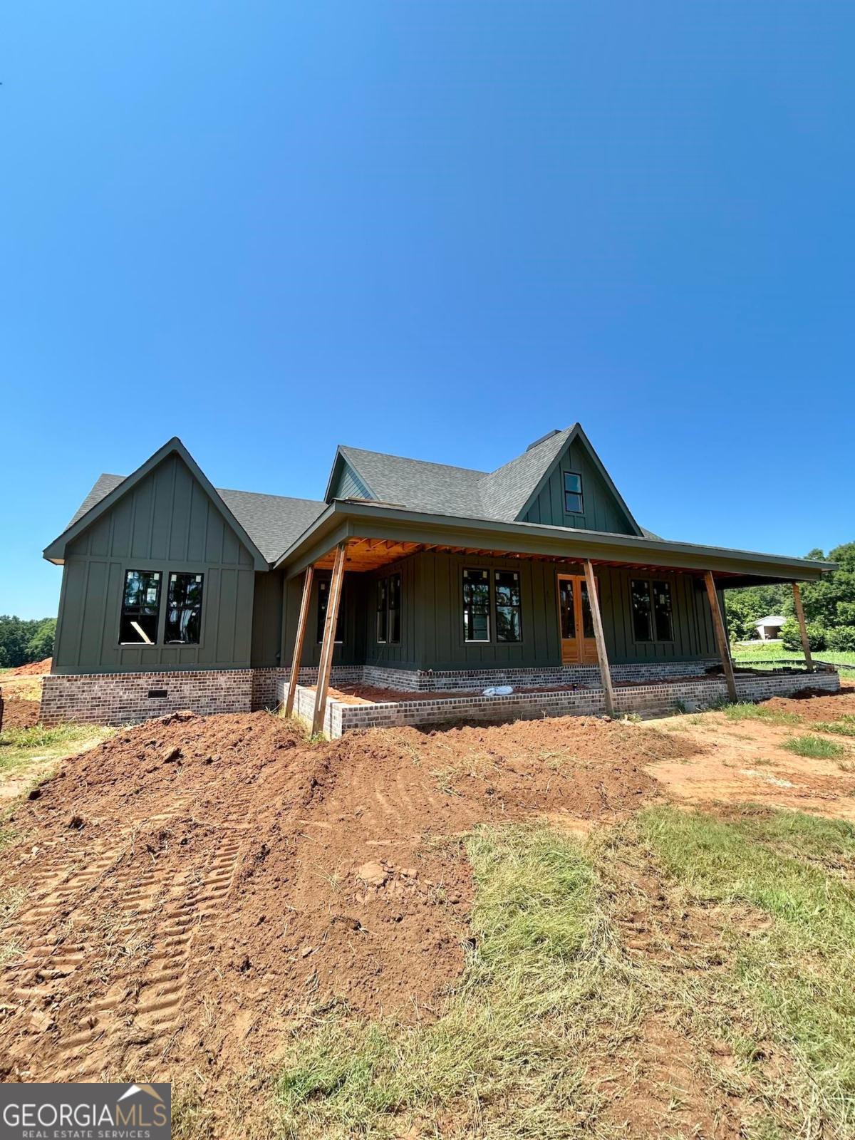 Enjoy country living right outside of town! This new construction home features 4 bedrooms and 3.5 bathrooms, complete with a separate office. These 5+ pristine acres of pasture land will be ideal for horses, goats, or a nice barn/workshop. The builder kept in mind our hot summer months by pre-wiring this home for a future pool. The nice level lot will provide a perfect foundation for an outdoor oasis! This property is ideally located between Madison and Lake Oconee. Bring your boat, as you will be minutes from Sugar Creek and Swords boat ramps. Estimated completion September.