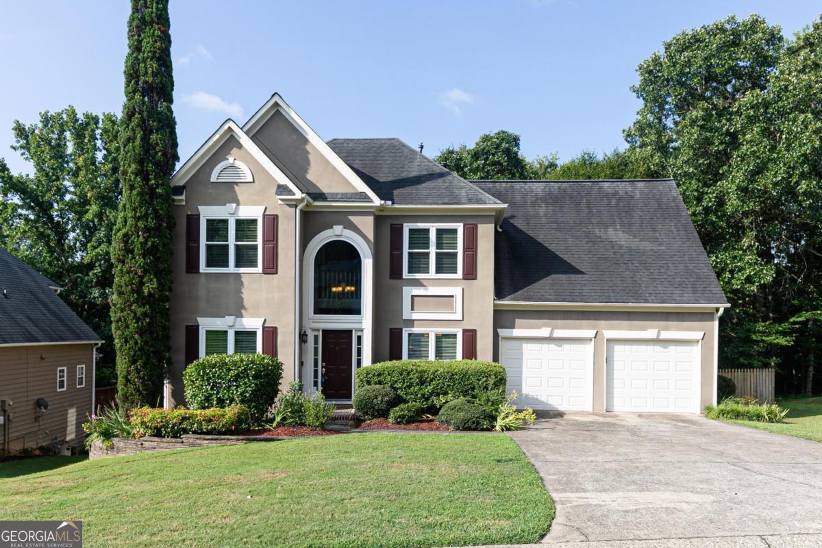 Welcome to this inviting home nestled in the desirable Eagle Ridge subdivision in Marietta. Featuring a thoughtfully designed layout and a private wooded lot, this home offers the perfect blend of comfort, space, and versatility. Step into the main level and enjoy the soaring cathedral ceilings in the spacious great room, complete with a cozy fireplace-perfect for relaxing or entertaining. The separate dining room provides an ideal space for gatherings, while the versatile bonus room can serve as a dedicated home office, playroom, or flex space to suit your lifestyle. The large kitchen offers plenty of room for meal prep and storage, ready for your personal touches. Upstairs, you'll find three well-sized bedrooms and two and a half bathrooms, providing comfort and privacy for the whole family. The partially finished basement adds additional living space and leaves room for your customization-whether you dream of a home gym, media room, or guest suite. Outside, enjoy peaceful views from the updated deck overlooking the fully fenced, wooded backyard-perfect for pets, play, or entertaining in a serene setting. Don't miss this opportunity to make your home in Eagle Ridge-conveniently located near shopping, dining, schools, and everything Marietta has to offer!