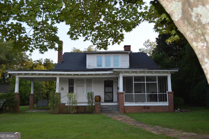 Location, location within walking distance to shopping, schools, restaurants, courthouse, in downtown Thomaston.  Spacious 2981:sq. ft. home home built in 1920. Front porch leads to large living room w/ fireplace, library, formal dining room, kitchen, back porch, laundry room, beautiful sun room, master bedroom, and full bath.Upstairs are 3 bedrooms, 1 bathroom, (needs installing) and office space. Needs TLC but is a beautiful home waiting for you and your family. Priced to sell "as is".