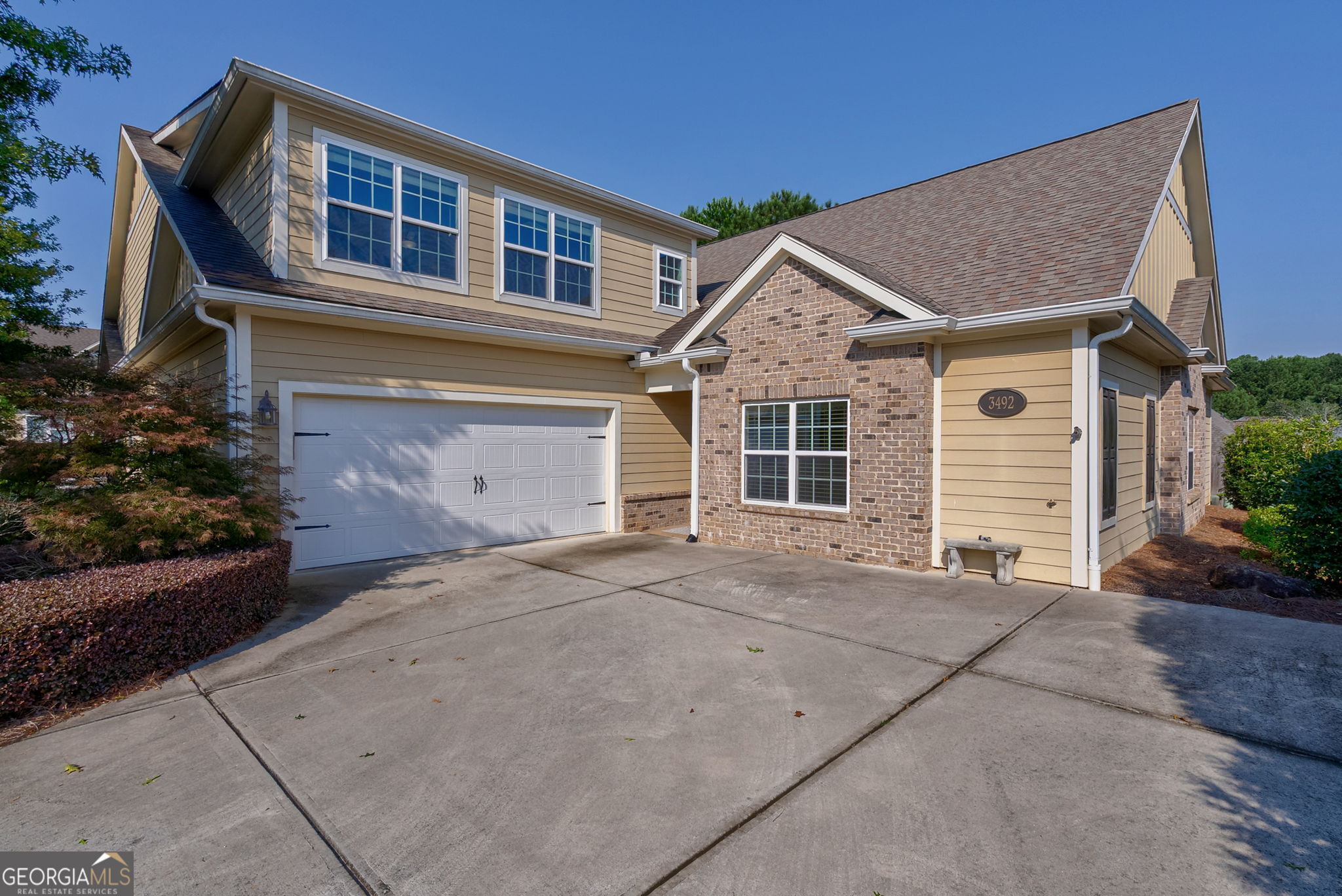 Experience maintenance free living at its best! This CONVENIENTLY LOCATED EMACULATE condominium is minutes from EPPS BRIDGE SHOPPING and is listed in the MUCH SOUGHT-AFTER Swim/Tennis CREEKSIDE Community in OCONEE County! This 4 BEDROOM & 3.5 BATH condo includes hardwood flooring throughout the main living area and an OPEN CONCEPT floor plan. The kitchen offers two breakfast/dining areas, breakfast bar/island, granite countertops, stainless appliances, large pantry, back splash, updated lighting and a gas range. There is plenty of room to entertain in the family room which includes soaring ceilings with so much natural light, a floor-to-ceiling stone gas fireplace w/ custom mantle, built-in bookcases and recessed lighting. The beautiful sunroom off the family room is perfect for your morning coffee and visiting with your neighbors! The owner's suite offers the MASTER ON THE MAIN, trey ceiling, a beautiful vanity with a granite countertop, a custom DREAM closet TO DIE FOR, a tiled shower with built-in seating and a dual vanity. The main level also offers two additional bedrooms, one of which could be utilized as an AT-HOME OFFICE, a full bath, multiple storage areas and a large laundry room. The upper level of the home is finished with an expansive additional bedroom/BONUS area, two LARGE closets for storage and a finished bath with updated features. Neighborhood amenities include a GATED ENTRANCE, CLUBHOUSE, POOL, TENNIS, FITNESS and a group of activities for those interested parties. These condominiums RARELY come available, so time is of the essence. THIS WON'T LAST LONG!