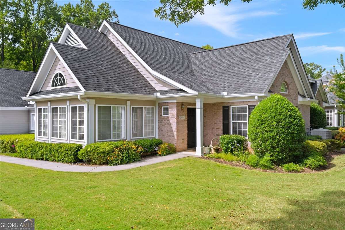 Orchards of Roswell welcomes you home! Just steps from shopping, dining, and parks with walking trails, this well maintained home and community offers the perfect blend of sophistication and convenience. Inside, you'll find a bright, open floor plan with two primary suites, each complete with a private ensuite bath and generous walk-in closets. Gorgeous hardwood floors throughout, the fireside family room pours into the dining area and gracious kitchen. The sunroom is light and bright and completes this fabulous home. The kitchen showcases granite countertops, plenty of custom cabinetry, newer appliances and is the perfect open-concept living and entertaining space! The community itself is a dream, offering a clubhouse with meeting rooms, card and game rooms, a billiards area, fitness center, and more. Orchards of Roswell is an active community! Tucked away at the back of the neighborhood, this home provides peace and privacy while still being close to everything you desire. Don't miss your chance to enjoy luxury, comfort, and carefree living in this exciting active adult community!
